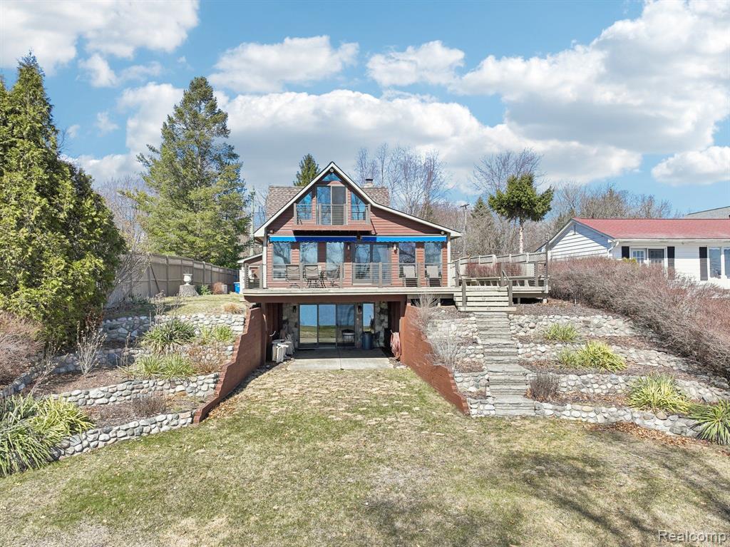 Welcome to the absolute best location on Lake Oakland! Sitting high overlooking the lake with unobstructed views from almost every room in the house! Full finished walk out with full bath, extra possible bedroom, cold storage room, and utility room. The last remodel the owner spared no expense, super solid with no center posts, the heavy duty I beams extend to the front and back giving the most opportunity for a well opened floor plan! Loads of high quality Anderson windows and sliding doors on all three levels, upper lakefront bedroom has a great Aspen feel to it with A Framed ceilings and a personal balcony space. The first floor boasts an open kitchen to the great room, open stairs, a natural stone fireplace, master en suite and laundry. The decking is HUGE wrapped from the side to the lakefront will fit multiple sitting areas. Super sandy soils, great current on the lake with no stagnant areas for green algae growth. Electric at the water for the pump and toys. Tiered stone landscaping, brick paver walk ways and driveway. We did have a variance approval with the township for a massive remodel, ask listing agent for those details. Opportunities on this section of the lake do not come up often. Wether your looking for a second home or your forever lake home with that up north feeling , do yourself a favor and take a look at this super solid home!