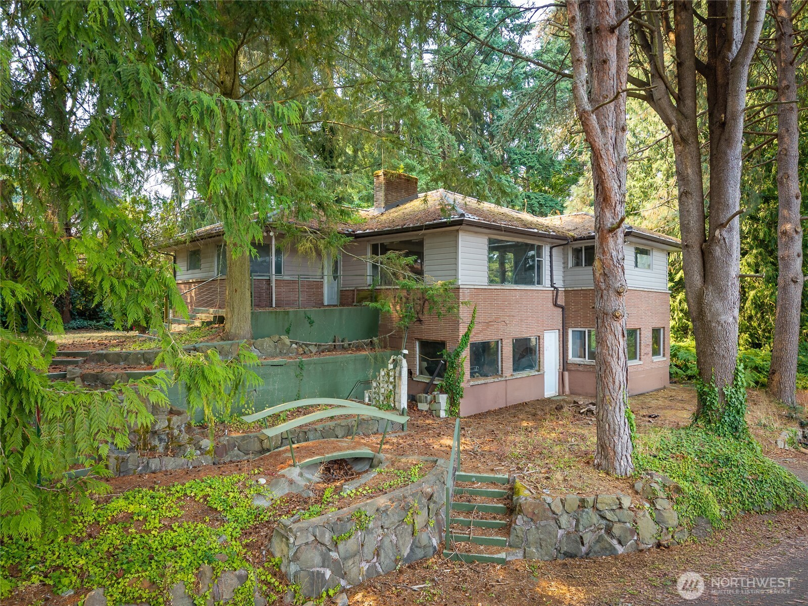 Exceptional opportunity in Edmonds offering nearly one private, wooded acre with mature trees, an existing two story home, and compelling development possibilities. LDR-M zoning supports a range of housing types, including detached homes, townhomes, cottage housing, ADUs, duplexes, triplexes, and fourplexes, with development possibilities of up to sixteen homes. The existing home offers flexibility for continued residential use, while the lower level provides an opportunity for additional living space or future rental income with further improvements. A similar sized lot adjacent to the property was recently developed, demonstrating the variety of residential development occurring in the immediate area. All utilities, including water, sewer, and electricity, are on site. Generous dimensions with approximately 127 feet of frontage and 310 feet of depth provide flexibility for a variety of site plans. Ideally positioned near the King and Snohomish County line with quick access to Highway 99 and I 5. Close to schools, shopping, dining, multiple golf courses, the Interurban Trail, Mathay Ballinger Park, and Lake Ballinger. A rare combination of privacy, existing residential use, income possibilities, and long term development opportunity. Buyer to verify all development potential, zoning, feasibility, rental use, and intended use.