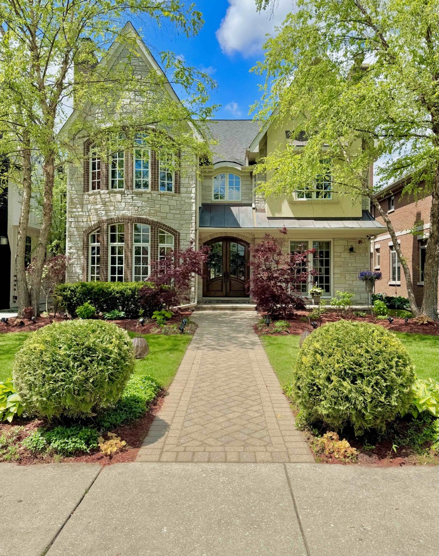 Located in the highly sought-after Uptown Park Ridge neighborhood, this custom-built home offers the ideal blend of space, comfort, and timeless craftsmanship, perfect for families of all sizes. Boasting 5,600 square feet of meticulously designed living space, this residence showcases exquisite trim and millwork throughout.   The open-concept layout seamlessly connects the living room, dining area, and kitchen to the spacious family room, creating an inviting atmosphere for both everyday living and entertaining. A dedicated private office on the first floor adds versatility for work-from-home needs or quiet study.   Whether you're hosting formal gatherings or casual get-togethers, the home's expansive layout provides the ideal setting. Built in 2007, this home features modern systems and contemporary finishes that reflect today's lifestyle, all while offering the charm and character of custom design.