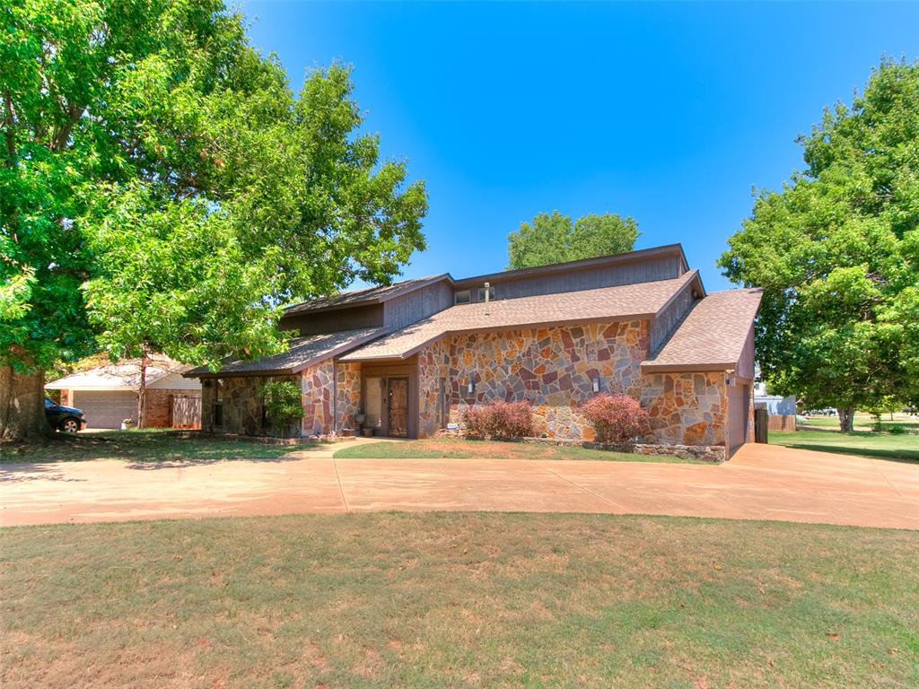 This 3 bedroom, 2.5 bath home is a single owned builder's personal residence, it's a rare find that speaks to the quality and care put into every detail. Situated on a Corner greenbelt lot, the home offers privacy and green space while staying close to everything NW OKC has to offer.Custom oak woodwork and large stone columns run throughout, giving the home a level of craftsmanship you simply don't find in today's construction. The main living area is complemented by a large upstairs loft with its own half bath and wet bar, perfect as a second living space or game room,  A 2 car garage , circle drive, and several updated features round out the home.Just minutes from Lake Hefner, residents enjoy easy access to walking trails, boating, and lakeside dining, along with some of NW OKC's best shopping and dining options nearby. Truly one of a kind, this home is a must see for buyers looking for character, quality, and location all in one.