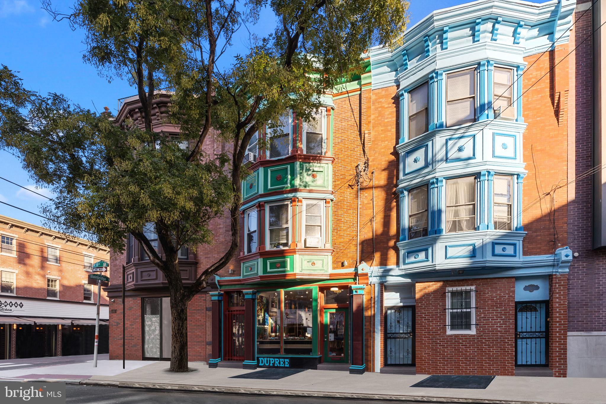 Welcome to your dream home at 703 S 6th Street! Located in Queen Village, this beautiful residence with its striking façade has so much to offer its new owners. This home includes 10 foot ceilings all throughout, 4 bedrooms, 3 full bathrooms, a full custom kitchen with an island and tons of cabinetry for additional storage and counter space. Hardwood flooring, windows that permit an abundance of natural light, all right above a spacious storefront, currently being used as a stunning Art Gallery. The first floor gallery includes a full kitchen, full bathroom, a huge finished basement, and access to the rear & side yard. This property offers new home owners a unique opportunity to use the space as desired: combine both units to create your dream home or live upstairs while generating income from the large commercial space below. Located at 6th & Bainbridge, in Queen Village which is known for its chic galleries, innovative restaurants, trendy shops, and shopping districts. This home is also located within the Meredith School Catchment. You do not want to miss this one; call to schedule your showing today!