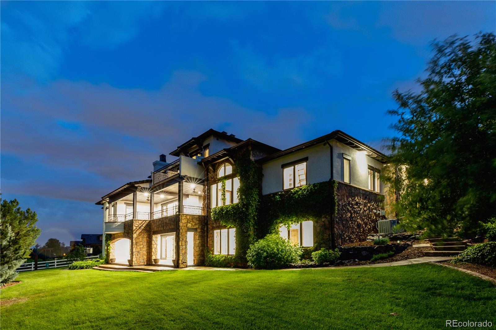 A full-scale, no-expense-spared redesign and remodel. This is a rare opportunity to own one of the largest homes in the city—nearly 12,000 sq ft—at a fraction of the cost to build new. Set on a half-acre lot at the top of a quiet cul-de-sac, the walk-out basement backs to open space with views of McKay lake. It’s like stepping into a brand-new home, and you’ll fall in love with the warmth, style, and detail throughout. Materials were selected for timeless sophistication: wide-plank DuChateau European oak flooring, rough-sawn beams, knotty alder solid doors, plaster-style walls, Italian Carrara marble, and barrel-vaulted brick ceilings evoke the feel of a luxury villa in Provence. The chef’s kitchen is anchored by two large islands—one in walnut butcher block perfect for slicing and dicing, the other in Carrara marble—with inset shaker cabinetry, 48" custom Viking range, 72" Viking fridge/freezer, dual dishwashers, and a nugget ice machine. A dream pantry with rolling ladder and marble bake center complete the space. The main level includes a living room/music room, elegant office with floor to ceiling alder built-ins, and a guest casita with private entrance and outdoor fireplace. The great room features soaring ceilings and a new limestone Isokern fireplace while a barrel-vaulted dining room includes a hidden china closet. The main-floor primary suite offers one of the six fireplaces, deck access and a spa-like bath with a massive dual-entry shower, freestanding tub, and built-ins. Upstairs: a loft with fireplace, desks, kitchenette, laundry, and three en-suite bedrooms—each with walk-in closets and balconies. Walkout basement: a full kitchen and bar, wine cellar, hidden safe room, gym, two bonus rooms, a large stage with projector, and expansive unfinished storage. New driveway included- buyer can pay upgrade for heated.  With a remodel spanning nine months at a cost of over a million you won't be disappointed. There are few homes quite this special!