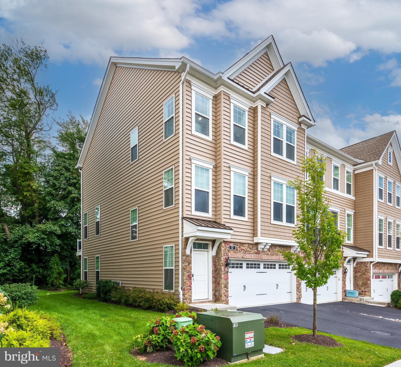 Rare Downingtown East End Unit! This North-East-facing Devonshire END UNIT, one of only two in Townes at Chester Springs, offers the community’s largest floor plan, exceptional privacy, natural light, and wooded views.Freshly painted and move-in ready with brand-new premium carpeting, approximately $75K+ in builder upgrades and improvements, upgraded hardwood flooring, gourmet kitchen, upgraded baths, and a spacious owner's suite with two walk-in closets.The finished walkout lower level with powder room adds flexible living space, while the private wooded deck and oversized 2-car garage provide added lifestyle and storage benefits.Located in the highly desirable Downingtown East School District with STEM Academy access. A rare combination of space, privacy, upgrades, and location!