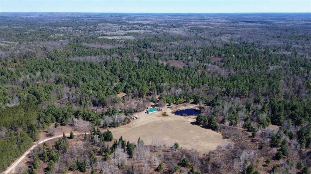 Premier 400?? Acre Hunting & Recreational Estate - Gladwin County, MichiganTucked into the heart of Mid-Michigan's premier recreational corridor in northeastern Gladwin County lies an extraordinary opportunity to own nearly 400 contiguous acres of managed, turnkey hunting and recreational land. This is a property that has been carefully developed over time with intention and purpose. Large, contiguous tracts of this size are increasingly rare in the Lower Peninsula, and even more uncommon is finding one so well-prepared for immediate use. Whether you are seeking a private hunting retreat, a legacy family property, or the foundation for a well-established hunting club, this offering delivers on every level.Exceptional Access & Trail SystemFrom the moment you enter the property off Wildwood Road - a paved county road providing reliable, year-round access - you will recognize the thoughtful planning that defines this land. A well-established and extensive trail system winds throughout the property, allowing easy access to nearly every corner. These trails are wide, maintained and suitable for ATVs or your truck, making it simple to navigate the full depth of the property, which stretches approximately one mile. A secondary access point from Miller Road at the opposite end provides additional flexibility for entry, exit, and strategic hunting access depending on wind conditions. This level of accessibility not only enhances the hunting experience but also makes the property highly enjoyable for recreational use year-round.Turnkey Hunting Property with Proven SuccessFor the serious outdoorsman, this property is truly exceptional. Positioned throughout the acreage are over 20 strategically placed deer hunting blinds, many of which are elevated and enclosed for comfort and protection from the elements. These blinds have been carefully located based on years of hunting experience, with a strong track record of success tied to natural travel corridors, bedding areas and food sources. This is not a property where