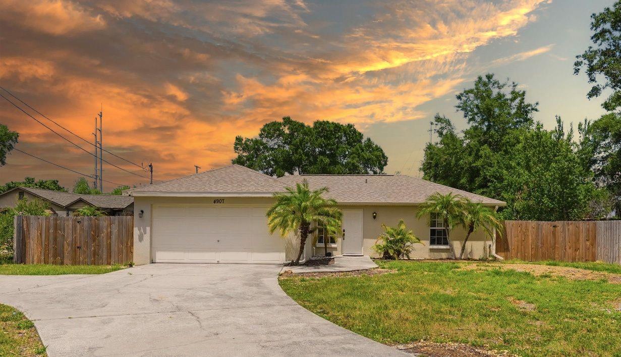 Rare opportunity to own a beautifully updated home on an expansive 0.52-acre lot in Tampa—offering space, privacy, and flexibility that’s increasingly hard to find. This 3-bedroom, 2-bath property is move-in ready and delivers a unique blend of modern updates and outdoor living potential.Inside, you’ll find new laminate flooring throughout, an updated kitchen featuring white cabinetry and butcher block countertops, and refreshed bathrooms with clean, modern finishes. Major system upgrades—including a new roof (2022), HVAC (2024), and water heater (2024)—provide peace of mind and minimize near-term expenses.The true standout is the oversized half-acre lot with no HOA, giving you the freedom to park boats or RVs, add a pool, create a garden, or design your own private outdoor retreat.Adding even more value, the property backs up to Carrollwood Village Park—a highly sought-after community amenity featuring a water park, skate park, dog park, walking trails, and open green space. Enjoy direct access to recreation and nature right behind your home, with no rear neighbors and enhanced privacy.Located across from newly constructed townhomes and close to shopping, dining, and major roadways, this home is positioned in a rapidly evolving area with strong future upside.Whether you're searching for a primary residence, investment opportunity, or a property with land and lifestyle appeal, this one stands out for its space, location, and long-term potential.