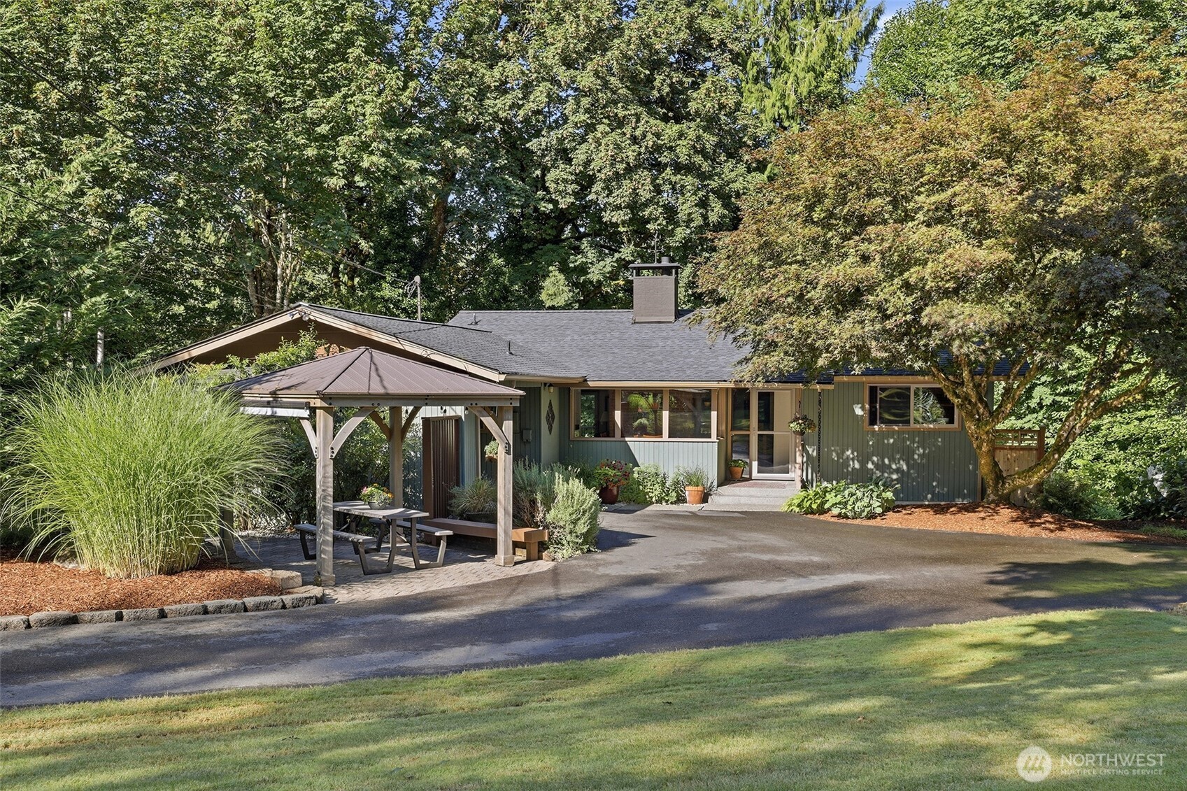 Beautiful custom home on private, quiet and secluded 3 acres on Jorgenson Creek. Park-like rural setting, but within minutes to I-5, stores, restaurants, services, St Peters Hospital, and Chehalis Western Trail. Brand new 30-year architectural composition roof. Efficient heat pump with air conditioning for those hot summer days. Living room with see through fireplace, large picture window, and sliding door leading to the newer large composition deck. From the deck, you can enjoy the sound of the nearby creek.  Great kitchen with quartz countertops, stainless steel appliances and open to the dining room. Lower level has large family room with woodstove and a bedroom with a large three-quarter bathroom with heated flooring- great for guests or mother-in-law suite.  Low monthly utility cost home.  Beautifully maintained grounds with RV parking, utility shed and garden space.