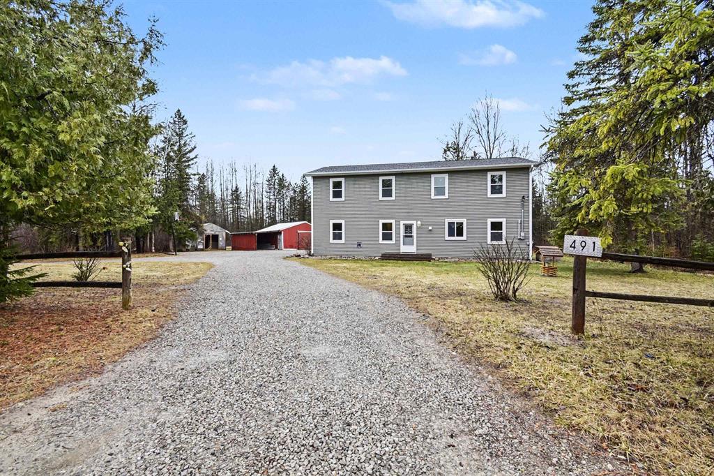 Discover the kind of Northern Michigan property buyers wait for at 491 N Walker Road in Twining. Set on 10.2 mostly wooded acres and adjoining state land, this spacious 4-bedroom, 2-bath home offers 2,544 square feet of comfortable living space with the privacy, flexibility, and recreational appeal that are getting harder to find.   Inside, a large sliding door wall helps bring the natural setting indoors and complements the open floor plan, creating bright, welcoming living spaces with abundant room for everyday living, entertaining, and hosting guests.   Outside, the features keep coming: a deck, scenic pond, circular driveway, deep and wide lot, 25x30 pole barn, chicken coop, and plenty of room for equipment, hobbies, animals, and outdoor toys. Newly installed fiber optic internet and 200+ amp electrical service add the modern convenience and utility that make this property as practical as it is peaceful. For buyers drawn to the Michigan outdoors, this setting is the real headline-adjoining state land and the broader Rifle River region place fishing, paddling, trails, hunting, wildlife, and year-round recreation at the center of everyday life. Conveyed at closing is a seller purchased home warranty package from America's Preferred Home Warranty.