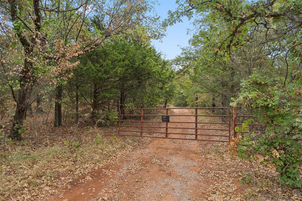 This 10 Acre Property offers many Possibilities! Land Investment or building your Custom Home! It does have an existing Shop with 1800 SF MOL, Lots of Beautiful Trees, Quiet and Secluded. Existing Utilities are OG&E, OEC Fiber, Well and Septic! Also full RV Hookup installed.  Moore Schools! Do not miss your chance to own this   Beautiful Acreage!