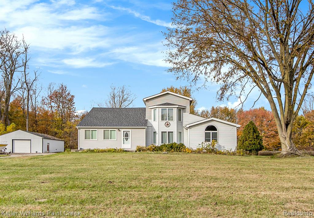 Welcome to 6700 Bethuy Road, a remarkable retreat on 34 private, wooded acres in Ira Township. This expansive 3,092-square-foot home features 4 bedrooms and 2.1 bathrooms, offering generous space and a blend of comfort and functionality. The main level boasts a spacious kitchen and dining area, a cozy family room, and the convenience of a first-floor laundry room. Outdoors, you'll find three outbuildings, including a large, insulated barn with high ceilings and extra high-voltage power – ideal for various projects or storage needs. Located close to Anchor Bay, this property combines the tranquility of nature with proximity to water activities and local amenities. Make this unique, spacious estate your home!