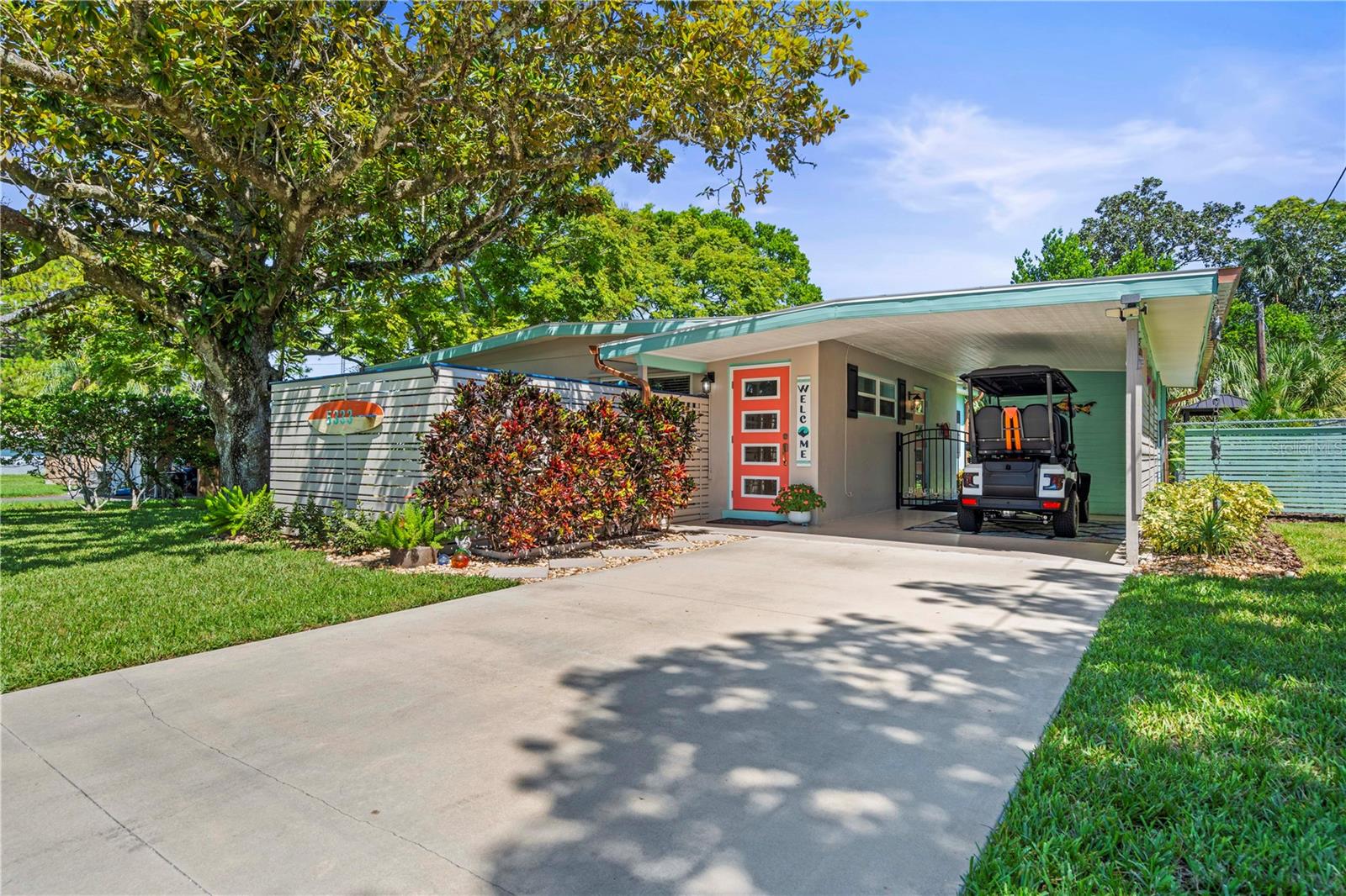 Welcome to your very own slice of paradise in New Port Richey, just minutes from the charm of downtown. This beautifully designed Key West–inspired 2-bedroom, 1-bath home combines comfort, character, and lifestyle — perfect for first-time buyers, a young couple, or investors looking for the ultimate Airbnb or vacation rental opportunity.

From the moment you arrive, the property stands out. A long driveway, shaded by a stunning mature tree, leads you to a vibrant entryway with a gated patio that feels like your own private beach retreat. The colorful front door and tropical touches immediately set the tone for what’s inside.

Step into a warm and inviting living room that flows seamlessly into the kitchen and dining areas. The kitchen boasts stainless steel appliances, beautiful cabinetry, and a custom backsplash that adds personality and style. Just off the kitchen, the dining room shines with natural light, making it the perfect place to enjoy meals and gatherings.

The home features two well-appointed bedrooms, a beautifully updated bathroom with modern tile, and one of the most fun and functional laundry rooms you’ll ever see — bright, themed, and full of coastal character, turning everyday tasks into a lighter experience.

Outside, the backyard is where this home truly shines. Enjoy a dedicated grilling area, a tiki-style seating spot under the palms, and a sparkling pool to cool off during Florida’s sunny days. A nautical-inspired red shed adds extra storage or could be reimagined as a creative space. Every corner of the yard is thoughtfully designed to make you feel like you’re on vacation.

This home isn’t just a place to live — it’s a lifestyle. Whether you make it your own tropical retreat or transform it into a standout short-term rental, the possibilities are endless.