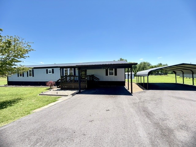 Lovely starter home situated on 1.4 acres, offering the perfect blend of comfort, convenience, and room to grow. Move-in ready and full of potential, this property feautres a spacious paved driveway, multiple carports for covered parking, and several storage buildings providing ample space for hobbies, equipment, and extra storage. Enjoy the freedom of country-style living with plenty of outdoor space for gargening, entertaining, pets, or simply relaxing in your own private setting.