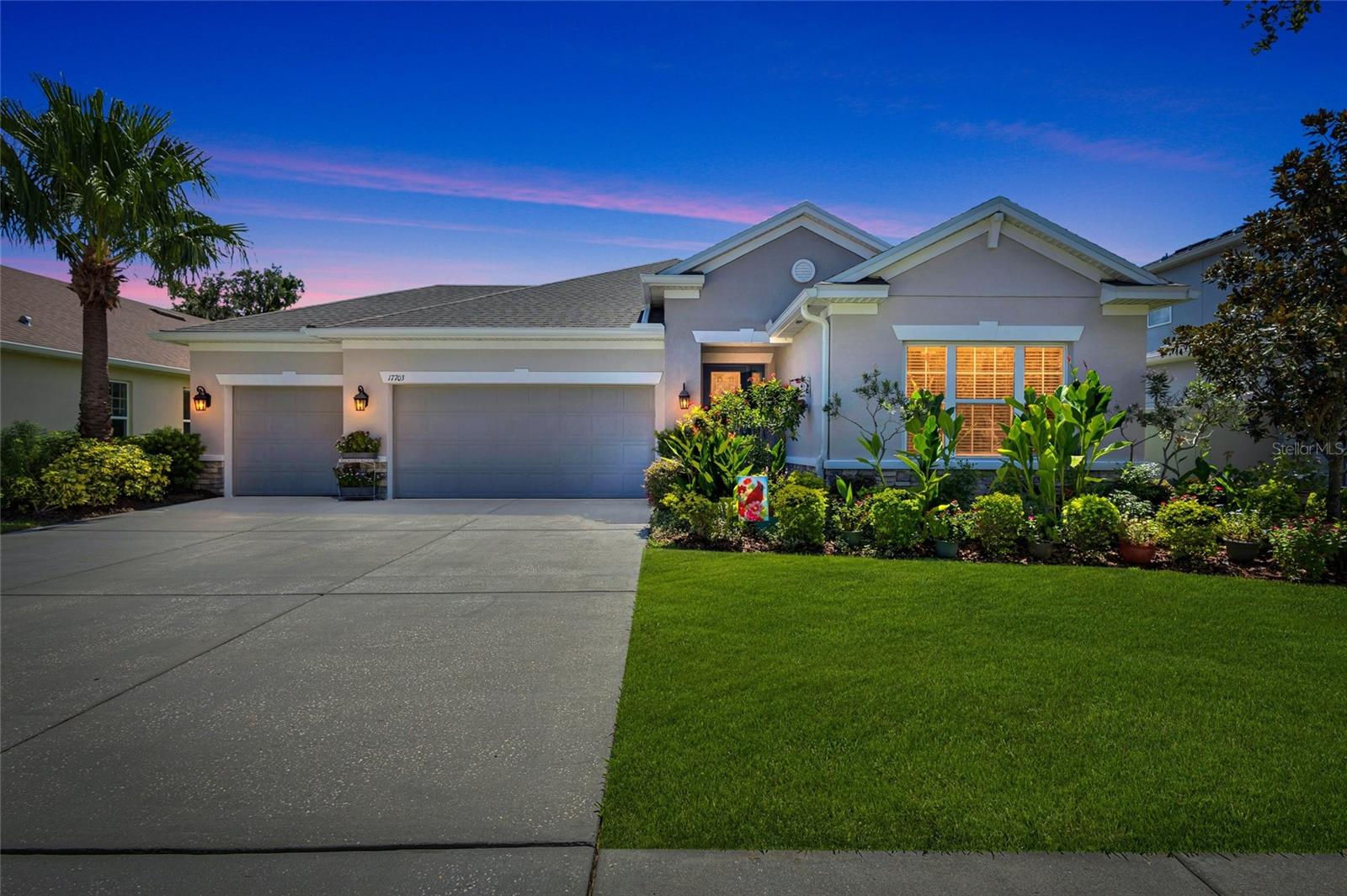 ~ Welcome to The Enclave at Channing Park ~ NO CDD!!! LOW HOA! “A RATED” SCHOOLS! TONS OF AMENITIES! Taylor Morrison Built Stunning “Antigua Model” is located on a beautiful pond front lot. Perfectly appointed 4 bedroom, 3 full bath, Large 3 Car Garage,  3 way split floor plan.  Ideal for In~Law and/or guest suite. You will be captivated by the upgrades and features from the moment you enter this absolutely breathtaking home with Upgraded Luxury Wood Laminate Flooring and a Lighted Tray Ceiling Center Hall Rotunda . The Enormous kitchen is an absolute Chef’s Kiss!  Built with every option you could want including a Butler’s Pantry & Beverage Station that lead into a formal Dining Room/ Flex Space.  Adorned with Quartz countertops, stainless steel appliances, Banks of drawers, and a spacious seated island. The Primary suite offers a peaceful escape with tray ceilings and a private spacious en-suite bath, complete with a garden tub, frameless glass shower, accented with listello details and a dual-sink vanity with granite countertops and a passthru from the enormous walk-in closet with closet organizer system.   The Pass thru offers direct access to the laundry room for added convenience. From your Great Room, you have Triple Pocket Sliding glass doors leading out to your fully covered, paved Lanai area giving you all the beauty of indoor/outdoor living while taking in serene views of a beautiful sunrise over the pond & watching natures wildlife in a Bird & Butterfly Friendly Habitat. The grounds of this home truly make you feel like you have entered a Botanical Garden.   Kick back at your paved outdoor Living Room equipped with a Beautiful Fire Pit and enjoy a spectacular Florida Sunset .   Channing park features resort style amenities: Basketball court, two doggy bark parks (One for large and one for small dogs), Soccer field, playground, clubhouse, two Separate Community Pools, Spa, Waterpark/Splashpad, fitness Center, grilling stations, skateboard park, walking trails.