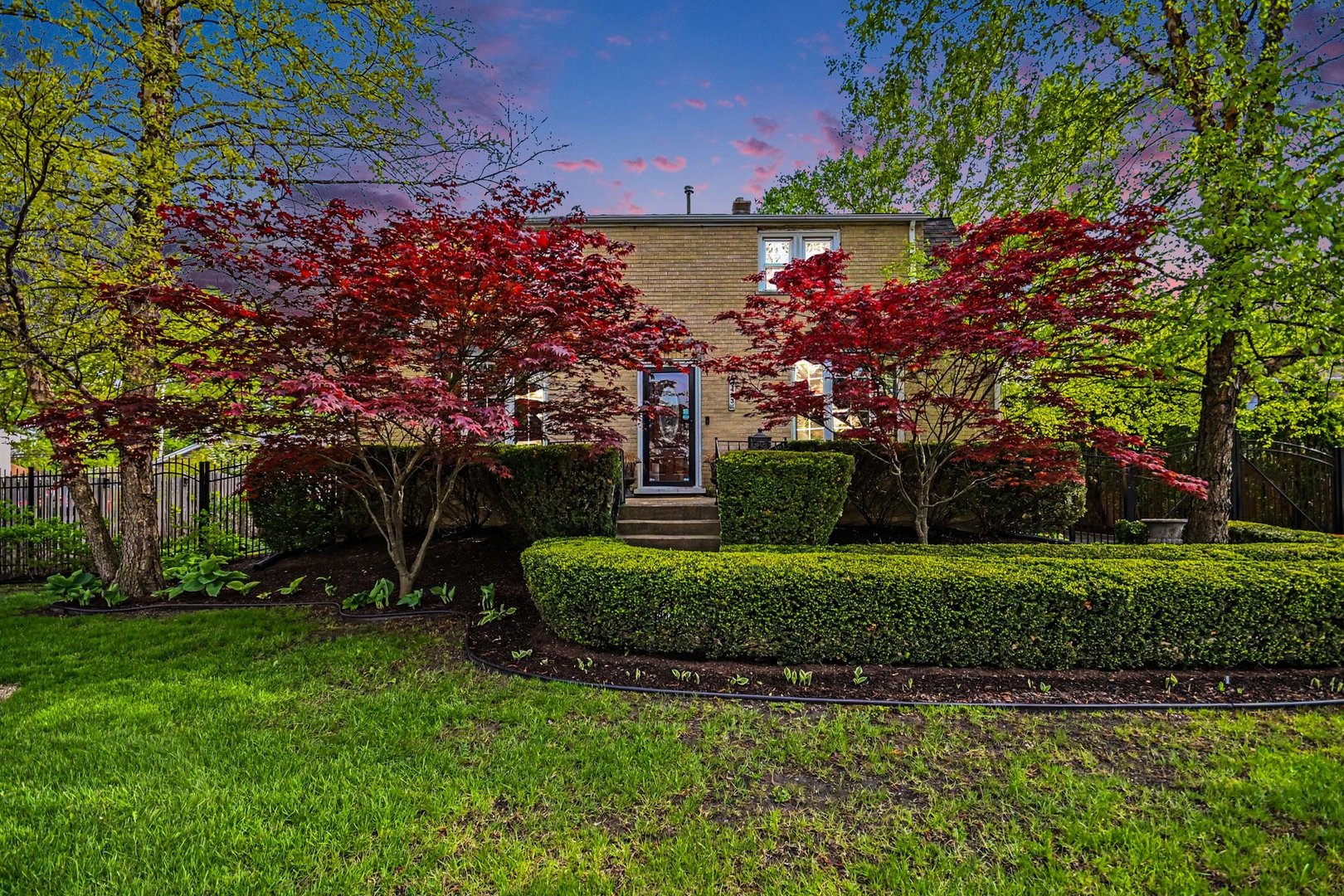 Beautifully maintained all-brick 2-story home offering 1,728 sq ft on a generously sized lot with stunning, professionally manicured landscaping! This charming residence features timeless curb appeal with mature trees, sculpted hedges, and a gated driveway leading to a detached 2-car garage. Step inside to find sun-filled living spaces and a flexible floor plan perfect for today's needs, including a spacious main-level living room that was previously used as a bedroom and can easily be converted back, a formal dining room, and a well-appointed kitchen with ample cabinetry and workspace. A full bath on the main level adds convenience and versatility. Upstairs offers two generously sized bedrooms plus a large den that could easily function as a third bedroom, home office, or additional living space. The home also includes a full basement with great potential for storage or future finishing. Enjoy outdoor living on the deck overlooking a private, picturesque backyard-perfect for relaxing or entertaining. Situated on an 80x132 lot in a desirable Burbank location, this home is close to Frances B. McCord Elementary, Liberty Junior High, and Reavis High School, and offers convenient access to parks, shopping, restaurants, everyday services, and major highways for an easy commute. A rare combination of charm, space, flexibility, and location-schedule your showing today!