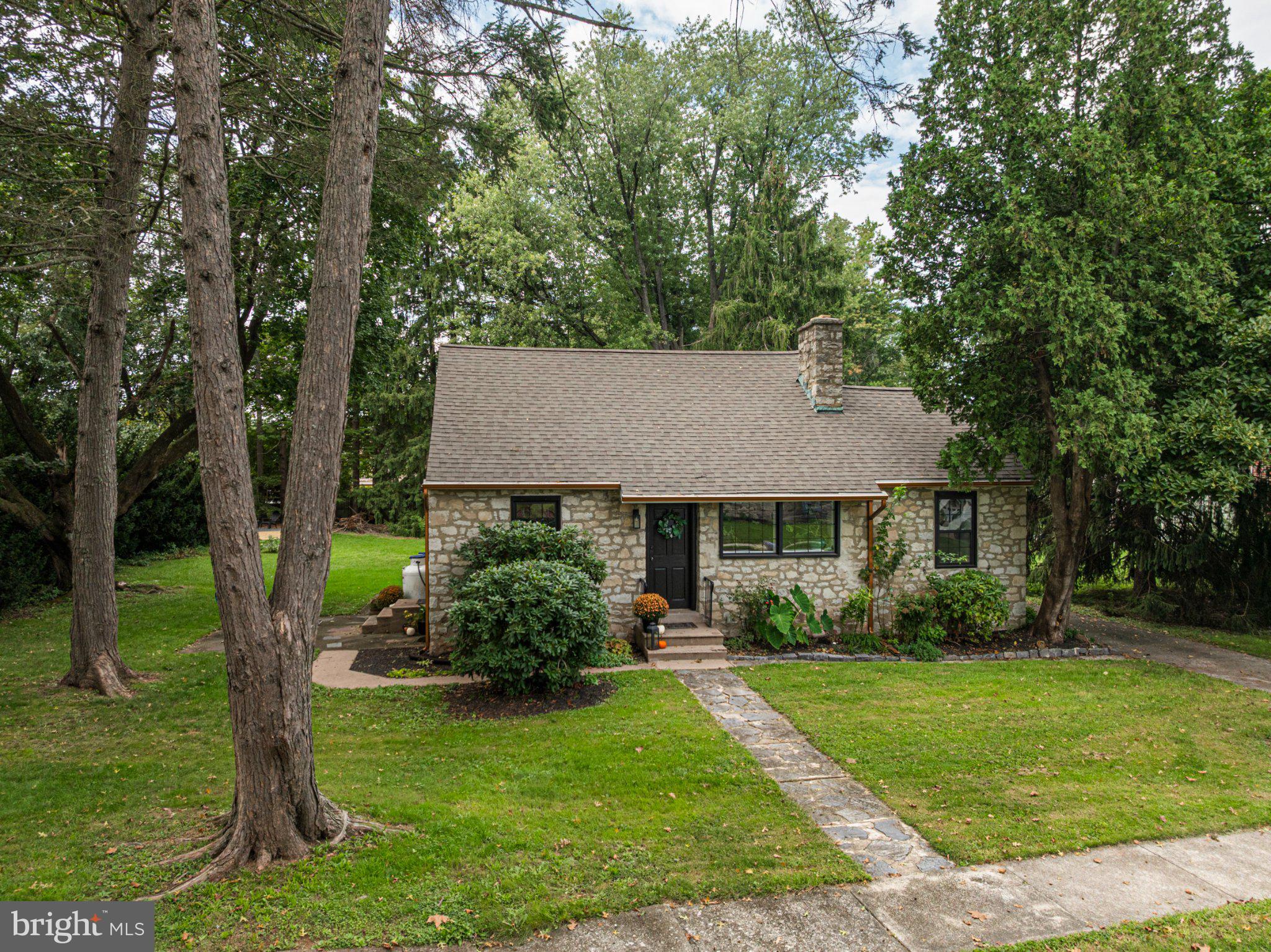 This charming cape cod cottage was beautifully renovated from top to bottom in 2021: electrical, plumbing, hvac, windows, roofing, everything! The two-bedroom, two bath with a bonus detached living space offers the perfect blend of modern comforts and peace of mind while having maintained its classic appeal. Step inside this charmer to discover an inviting open floor plan with living and eat-in kitchen space - plenty of natural light, deep window sills, marble countertops, custom cabinets and a beautiful stone fireplace greet you. The main level boasts a serene bedroom that looks out on the beautiful and private side and back yards. The first floor full bath has marble flooring and a deep bathtub perfect for soaking after a long day. The main floor is completed by a separate tv room - which could easily be repurposed as a dining room, office or playroom - and a mudroom/laundry room with access to the back deck. Upstairs, the owner's suite provides a peaceful retreat, with a spacious full bath and dressing nook. The partial daylight basement has 8-foot ceilings and offers endless possibilities for additional living space. Outside, the property sits on a generous 0.36-acre lot, featuring beautifully landscaped front, side and rear yards. The existence of fairies has not been proven, but if they exist: this is where they live: 100+ year old trees and 15 foot privacy shrubbery line the back & sides of the property and a stone outdoor fireplace adds to the magical nature of the property. The yard has a side patio, back deck with ramp and large level yard ideal for outdoor gatherings.  A brand new shed pad is ready and waiting or use it for your fire pit! With secluded views of trees from the deck or patio, you can enjoy your morning coffee or an evening glass of wine. It doesn't stop here though! The detached garage not only has a 1-car garage, but also boasts a spacious finished living area perfect for man-cave, craft & hobby area, a home office or business or use the roughed-in plumbing to create an in-law suite! The peaceful Kenilworth Park is less than a block away, with walking trails, tennis courts, a disc golf course, playground, playing fields and fishing pond! Situated 2-minutes from Routes 422 and 100, you don't have to sacrifice an idyllic retreat for the convenience of having all of your shopping and life-needs just minutes way. Don't wait, this home won't last - schedule a showing today!  Seller is a licensed real estate agent.