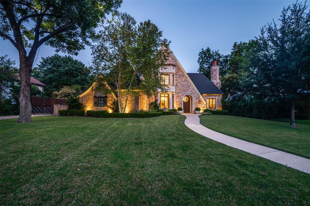 Custom estate in sought-after Forest Hills, designed by Lloyd Lumpkins, influenced by Sir Edwin Lutyens and built by Randy Hughes (of Todd & Hughes).  Set on nearly half an acre surrounded by towering trees, this timeless traditional home blends classic architecture with refined craftsmanship. Cast stone, hand-laid brick, and clad windows define its elegant exterior, while inside, 5 bedrooms (primary and guest down), 4 full and 1 half baths, and multiple formal and casual living areas offer flexibility and comfort. Interior highlights include imported tile, custom millwork, tall ceilings, hand-finished walls, and hardwood floors. The chef’s kitchen features a commercial-grade range, prep area, and large island opening to the morning room and family space with extended backyard views. Additional features include a full wet bar, private gun closet, multiple fireplaces, and a spacious game-media room. Perfect for entertaining with a covered patio, outdoor kitchen, and 3-car garage with gated entry. Near White Rock Lake and the Dallas Arboretum.