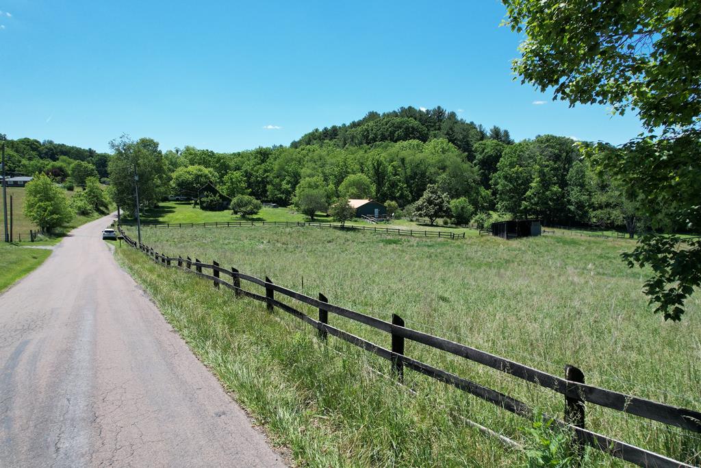 Beautiful 2.43-acre tract with long paved road frontage, easy access, and a mostly cleared, fenced landscape. With no deed restrictions and a recent conventional septic perc test, this property is ready for your dream home or a small homestead.  The land features a mix of topography with a good building site, while mature trees along the eastern boundary provide added privacy and character. Enjoy peaceful country living with scenic views and plenty of room to spread out, all just 20 minutes from Wytheville and I-81.