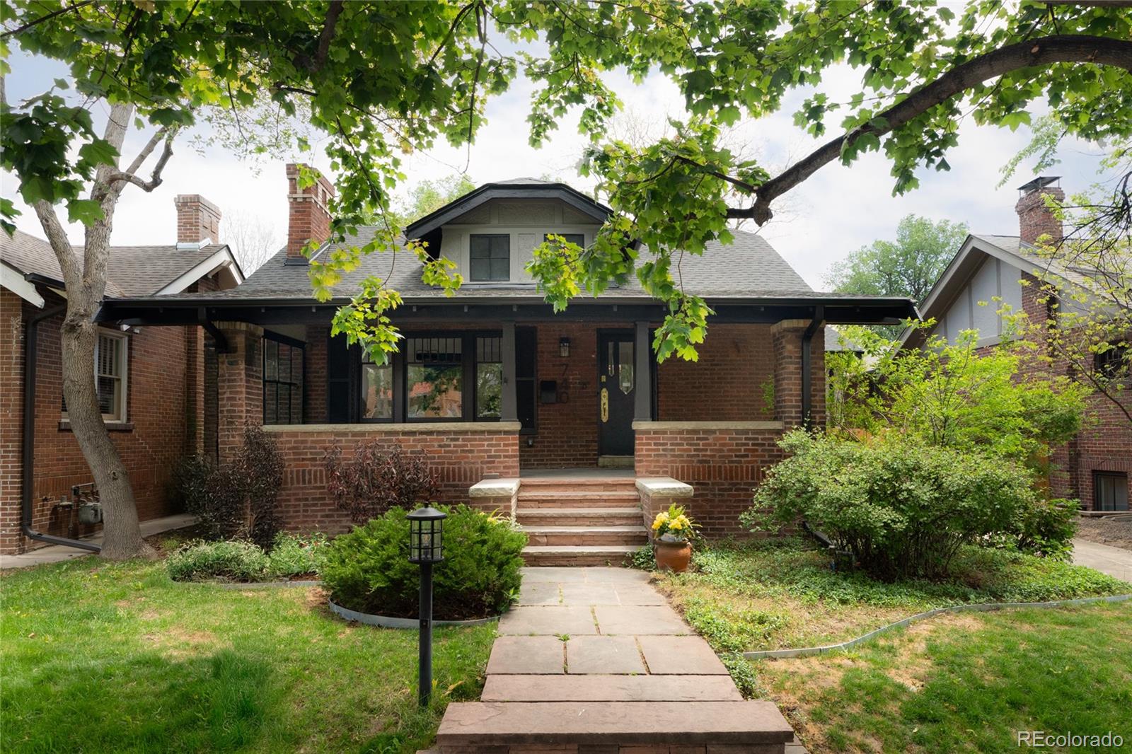 We are pleased to present a unique opportunity to own a fully reimagined historic home in the highly coveted Congress Park/Cherry Creek North location—perfectly positioned on a private pocket park accessible only to neighboring residents. With unobstructed green space views and an unparalleled setting, this home delivers a level of exclusivity rarely found. A gracious foyer introduces a thoughtfully designed main level, where a sophisticated home office and elegant sitting room create an immediate sense of refinement. Rich hardwood floors and abundant natural light lead past the dedicated dining room to the showstopping great room, where 15-foot floor-to-ceiling glass doors blur the line between indoors and out, perfectly framing the serene park beyond. The chef’s kitchen is a true centerpiece, featuring custom walnut and painted cabinetry, an oversized island with seating for five, quartz countertops, designer tile, and a full suite of premium Dacor appliances, including a gas range and specialty wall oven—designed for both elevated daily living and effortless entertaining. The main-level primary suite offers a private retreat with a spa-inspired bath, complete with dual vanities, exquisite tilework, a glass-enclosed shower with rainhead and handheld fixtures, and a spectacular walk-in closet. A chic powder room and well-appointed mudroom with pantry complete the main level. The lower level impresses with rare 8’6 ceilings, a spacious family room, two generous bedrooms, flex space, and a beautifully designed bath with dual vanities and a soaking tub. A stylish dry bar leads to a hidden bonus space concealed behind a custom bookshelf ideal for a theater, library, or private lounge. Outdoors, a generous deck creates the perfect setting for entertaining, with direct access to the exclusive park—an extraordinary extension of your living space. A seamless blend of timeless architecture, modern luxury, and an irreplaceable location—this is truly a one-of-a-kind offering.