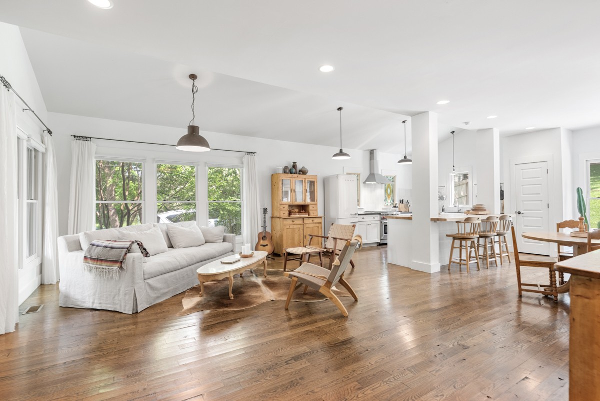 Stunning custom retreat in Lockeland Spring's iconic Little Hollywood! Nestled in a serene setting, yet within walking distance of East Nashville's acclaimed local restaurants and coffee shops. Meticulously maintained energy efficient home with impressive upgrades. The screened in porch, covered front porch, sprawling back patio and sizable fenced backyard create tranquil outdoor living among gorgeous trees. Brilliant kitchen with an expansive island, high end appliances, stained glass windows, and pantry. Spacious primary suite with vaulted ceilings and walk-in closet. Beautiful hardwood flooring throughout, tons of windows, built-in shelving. Two car attached garage. Rare chance to own in this sought-after neighborhood that backs up to Shelby Golf Course. Walking distance to Lockeland Table, Urban Cowboy, Ugly Mugs, Rosepepper, and so much more. In Lockeland Design Center GPZ. See Media for extensive list of updates.