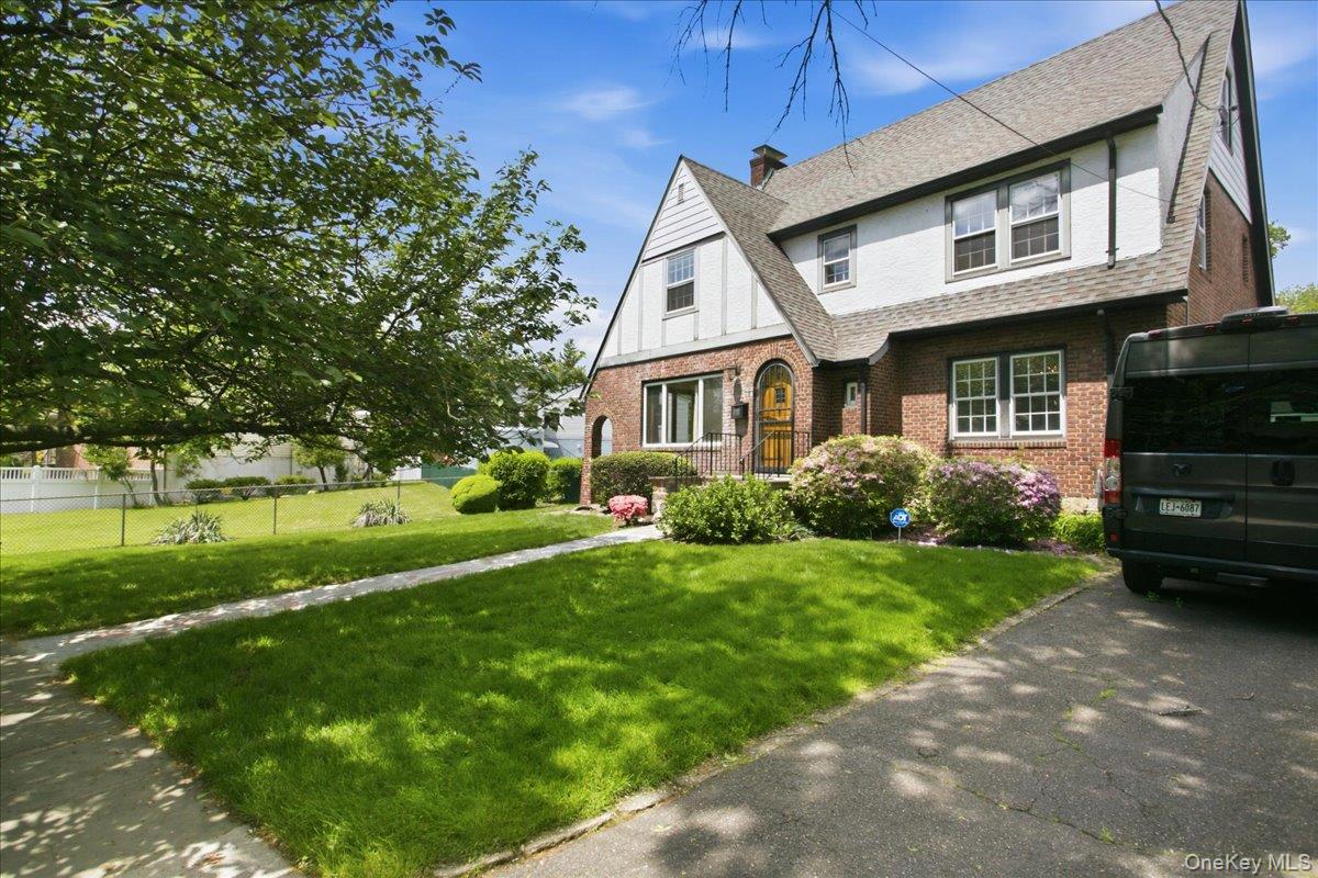 Offering the only Brick Tudor style home for sale in lower Westchester under S1,000K, right now. Conveniently located near Riverdale/NYC, in one of the oldest, commuter friendly, historical neighborhoods of Yonkers, LUDLOW PARK, the home's timeless character and appeal dates to 1930, a time when top quality construction mattered. Thankfully, the current owner continued that commitment by maintaining & renovating all with care over the past 43 years. Situated on a quiet street with a cherry tree out front, it still has all its original details intact - smooth plaster walls, huge windows, high ceilings and beautiful, gleaming oak floors. The main level has a well-planned lay-out with an open-feel, featuring a front to rear hall allowing for convenient access from the front as well as the garden to the new, well-appointed, spacious kitchen with a tri-angular appliance layout, a fitted pantry closet & cheerful breakfast nook. All baths were recently fully renovated with high quality materials & fittings. Bedrooms are all generously sized, featuring good closet spaces - and a cedar closet in the primary bedroom. The 3rd level is fully finished & was used as an additional bedroom and study. It has plenty of storage space as well. The full, unfinished lower level is accessible from both the exterior & interior. There is a young boiler, up-dated electrical service and a newer architectural shingle roof. Ludlow Park offers the best commute to NYC, the Bronx or anywhere in the Metro NY area. An 8-minute walk will take you to the newly renovated Ludlow train station with 30 minutes to Grand Central. Or walk a little longer to NYC public transport or Express buses. Some folks think Ludlow Park is an extension of Riverdale