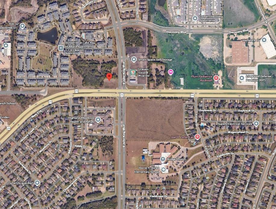 Prime corner location with strong visibility and steady traffic at Hwy 276 and S John King Blvd, ideal for commercial development needs.Entitled 1.2 acre car wash pad with active permit enabling immediate development or income while remaining land supports varied uses.Located in Rockwall’s active retail corridor near high-demand anchors like H-E-B, ensuring steady consumer draw and traffic activity.Surrounded by affluent, fast-growing residential areas offering strong household incomes and dependable long-term commercial demand.Dual-frontage, flat site allowing flexible multi-pad layouts ideal for QSR, medical, service, or retail operators seeking visibility.Near Rockwall Technology Park and key employment hubs, capturing reliable daytime traffic and supporting essential commercial uses.