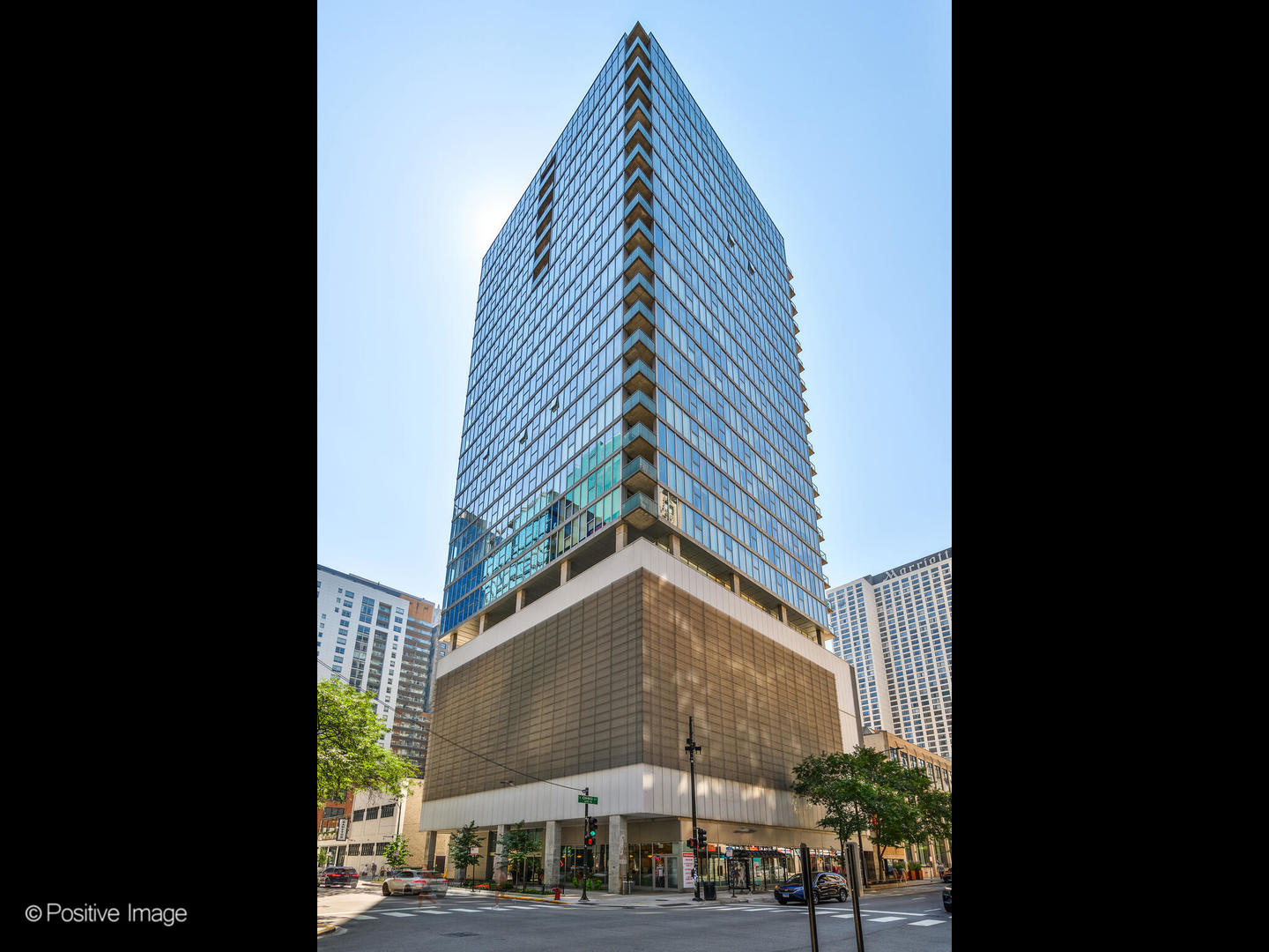 Dramatic and heavily upgraded three bedroom/three bathroom penthouse level modernist retreat in the heart of Streeterville. As you enter this home you are greeted by sweeping views from the floor to ceiling windows and 11' ceilings. A practical, yet open concept floor plan offers the feeling of a single family home and the convenience of full amenity condominium living. The formal living & dining rooms flow seamlessly to one another, anchored by a free standing fireplace and flanked by an expansive 47'  terrace spanning the entire western elevation of the home. The terrace is  an ideal spot to entertain and take in the sunsets and conveniently equipped with gas, water & electric. A well designed chef's kitchen offers a large large island with plenty of seating, white quartz counter tops and glass backsplash. Custom Italian cabinetry, and an impressive appliance package includes a 48' Thermador refrigerator & freezer, Wolf range/oven, Miele convection oven/steam & wine refrigerator.  Two spacious guest bedrooms are en suite with stunning south facing views and light. The current owners undertook a complete reconfiguration of the master suite, creating a true sanctuary, awash with luxe finishes and a more functional plan. The new suite allows for both a sitting area and work space in addition to a second outdoor space with views of the lake and Miliienium Park and an enviable 14 X 10 dressing room/walk in closet. The spa caliber master bath is a total wow,  boasting a free standing oval tub, floating double vanities plus make up vanity with pebbled quartz counter tops, heated floors, Duravit plumbing fixtures and an oversized walk in shower with Porcelanosa tile, and rain shower head. The sleek white Italian cabinetry houses incredible storage with hidden built ins. Dark-stained hardwood floors, motorized shades, contemporary lighting, custom closets & built ins throughout. Secondary access allows for a mud area with convenient access to the full laundry room with sink & cabinetry plus a separate utility room. THREE PARKING SPACES INCLUDED! Two prime, heated side by side + an additional space. Full amenity, boutique building with 24 hour door staff, indoor pool, fitness center and storage steps from Michigan Avenue.
