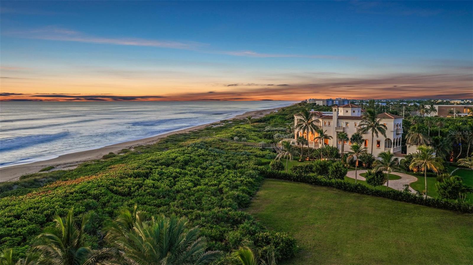 Welcome to Castillo de Mar, a landmark oceanfront estate in the intimate, gated community of Galleon Bay. Blending modern design with Mediterranean elegance, this residence offers 10,585 sq. ft. of living space (12,950 total) on 2 pristine acres of direct ocean frontage. Designed for luxurious living and entertaining, the home features 5 ensuite bedrooms, 6 full baths, powder room, a 2-story guesthouse, and a climate-controlled 5-car garage. A recent expansion added an additional landscaped oceanfront acre with a grand circular drive, while renovations include impact glass, pool, whole-house generator, entry gate, and automated window treatments (to name a few). Here, privacy meets convenience—10 minutes to private FBOs with U.S. Customs, 0.8 miles to yacht dockage for vessels up to 100’, and a short drive to Palm Beach. A rare opportunity to enjoy world-class luxury, effortless entertaining, and South Florida’s most desirable coastal lifestyle.