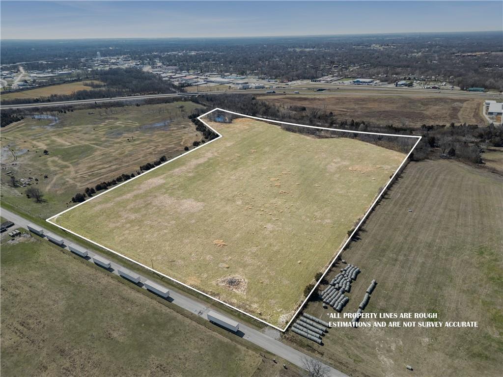 23± Acres | M-2 Industrial Zoned Land | Near I-49 | Nevada, MORare opportunity to own 23± acres located within the city limits of Nevada, Missouri in an area surrounded by existing warehouse and industrial development. The property is currently used as productive hay ground and would also make excellent pasture for livestock.This versatile tract is zoned M-2 (Heavy Industrial), allowing for a wide range of commercial and industrial uses while still offering immediate agricultural use. Located just minutes from I-49, the property sits in a growing industrial corridor and is well positioned for warehouse, distribution, manufacturing, storage, logistics, or other industrial development.The property offers approximately 680 feet of road frontage, providing convenient access for equipment, trucks, or future development. A rail line borders the west side of the property.City water and rural water are both available, and electric is available at the road. City sewer may be available nearby. The acreage offers ample space for development while maintaining convenient access to major transportation routes.The property is not located within a floodplain.The property has been fertilized annually and maintained for hay production. The seller currently has a hay crop established for this season, and the new owner will take possession after the hay is cut.Properties of this size located within city limits and near existing industrial development are becoming increasingly difficult to find.For additional information or to schedule a showing, contact the listing agents.