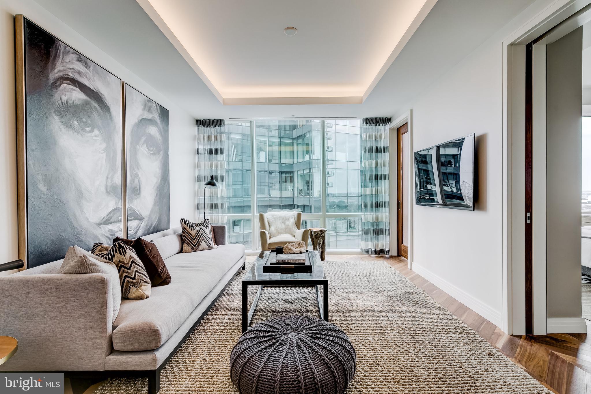 Welcome to the Four Seasons Private Residences in the heart of Baltimore’s Harbor East, where luxury, location, and lifestyle converge. From the 21st floor, this gorgeous 1-bedroom, 1.5-bathroom residence offers spectacular views of the city skyline and harbor through floor-to-ceiling windows. This refined residence features rich walnut herringbone flooring and high-end finishes throughout. In the kitchen elegant cabinetry, a gas stove, built in microwave, and elegant quartz countertops create a warm space for cooking for family and friends. The primary suite includes a walk-in closet and a luxurious marble bathroom with double sinks and walk-in separate shower.  As a rental resident in the Four Seasons, you’ll have exclusive access to the private 28th-floor amenity level featuring an indoor saltwater infinity pool, sauna, outdoor deck, fitness center, meeting rooms, and lounging areas — plus a dog-walking area for your furry family members. You’ll also enjoy full access to all hotel amenities, including the outdoor pool, large fitness center, and valet services. There are four on-site restaurants in the Four Seasons, and many amazing dining options just a short walk away in Harbor East and Fells Point. Shopping, parks, harbor activities, museums, and miles scenic waterfront walkways are all close enough to enjoy every day. Experience luxury living at the Four Seasons, it’s more than a residence, it’s a lifestyle.   One assigned garage parking space is included. This property is also for sale.