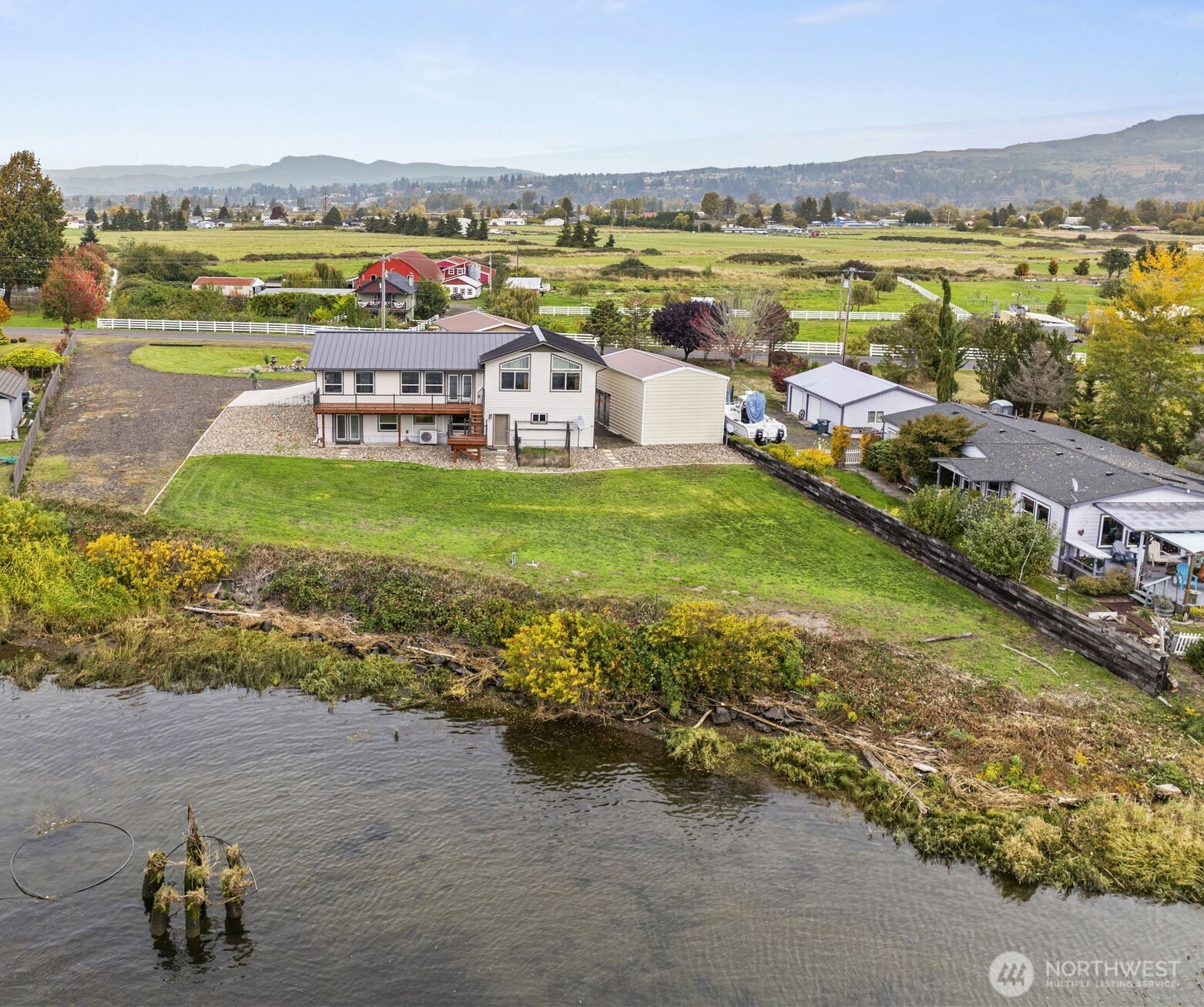 Riverfront home offering 3 bedrooms (w/potential of 4 or 5!) 2 baths plus sweeping Columbia River & Oregon Hills views! The main level features a spacious living room w/vaulted ceilings & exposed wood beams, cozy pellet stove, new carpet, updated windows & abundant natural light, large dining area, efficient kitchen & pantry. Downstairs includes a spacious flex/family room, additional suite, 3/4 bath & room for a ginormous walk-in closet; den/office, laundry; access to 2-bay extra deep garage. Outside enjoy landscaped yard, shop w/220V & exhaust system, RV/boat storage plus additional carport. Located minutes from downtown Cathlamet - craft brewery, fabulous dining options, full-service market, nursery & MORE! Fishing out your back door!