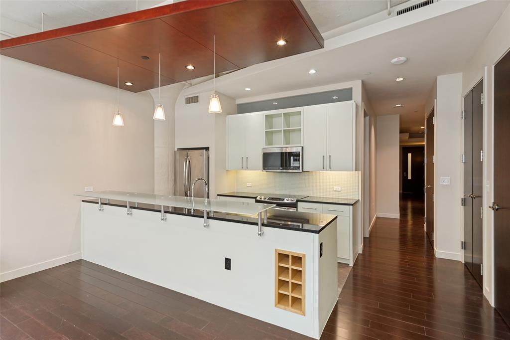 Lock-and-leave living at its finest in the historic Montgomery Plaza. This immaculate 2-bed, 2-bath residence sits on the 3rd floor of the West Tower and offers every comfort you’d expect from a truly effortless lifestyle. Unit 1311 features electric shades, rich dark hardwood floors, stainless-steel appliances, granite countertops, and a generous custom-designed primary closet, AND a new stack washer dryer. Fresh plush carpet has just been installed in both bedrooms.The light-filled living and kitchen areas create an uplifting space—ideal for entertaining or simply enjoying a peaceful, low-maintenance way of life.Montgomery Plaza’s resort-style amenities include a sparkling pool, private cabanas, fire pits, built-in grilling stations, a 14-seat movie theater, a top-tier fitness center, a putting green, resident lounge, and 24-hour concierge service.Join the vibrant community of urban residents who appreciate the easy, carefree lifestyle Montgomery Plaza offers. This home is perfectly situated on the same floor as the assigned parking, pool, and fitness center—true convenience just steps from your door.