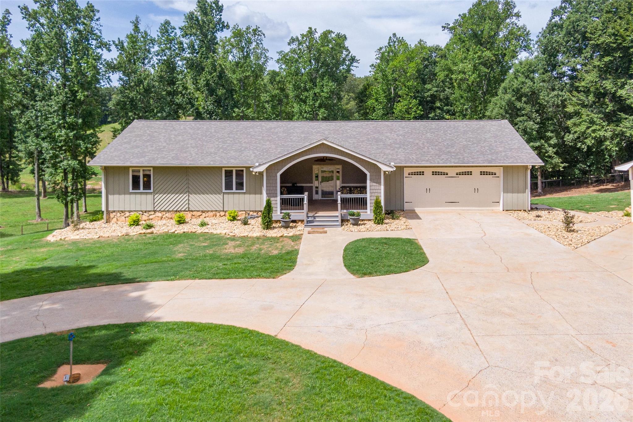 FANTASTIC HORSE FARM - FIRST TIME ON THE MARKET! 8 MILES TO TIECThe main level offers generously sized bedrooms, including a primary suite with two closets and an ensuite bath featuring a double vanity, jetted tub/shower. A bright Florida room with vaulted ceilings provides additional year-round living space, while the oversized covered front porch is perfect for relaxing and enjoying the peaceful surroundings.The finished basement adds over 1100 square feet of additional living space, complete with a full kitchen, family room, bedroom with a large closet, full bath with walk-in shower, ideal for guests, multi-generational living, or entertaining. An additional 900± SF of unfinished basement provides excellent workshop and storage space with garage door access.Outside, the amenities continue with an oversized double attached garage, detached triple carport with RV parking, outdoor bar, covered patio, and a fenced pool area. Nature lovers will appreciate the stocked pond, creek, and scenic setting.Equestrian enthusiasts will love the impressive improvements, including a 48’ x 68’ metal pole barn, two horse stalls with tack and hay room, board fencing, round pen, two separate fenced pastures, and an approximately 90’ x 180’ riding arena. A 36’ x 36’ heated shop with two bay doors and a 12’ x 12’ office provides outstanding workspace for hobbies, equipment, or a home business.Additional features include:Roof new in June, 2026Hardwood and luxury vinyl plank flooringSpectrum internet Original ownerThis unique property offers the perfect blend of comfortable living, workshop space, and equestrian amenities—all in a peaceful country setting.