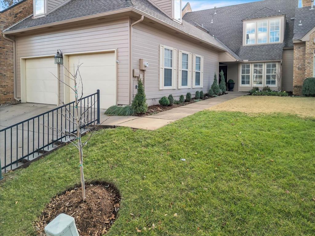 GOLFERS...Wake up just steps from Oak Tree Golf Club and enjoy the ultimate lock-and-go golf lifestyle. Gated community, tree-lined streets, main-level living, and a beautifully renovated townhouse designed for comfort and convenience and is MAINTENANCE FREE. Drive your golf cart onto the course from the neighborhood. Golf, relax, repeat.Golf for you… summer fun for the grandkids! be part of Oak Tree Golf Club with main-level living, private guest space upstairs, and access to the clubhouse, pool, fitness center, tennis, and pickleball all summer long (membership). The perfect home for grandparents who love golf and family time. A perfect home for young families that enjoy being outside together. Truly Edmonds hidden gem.The updated kitchen includes painted cabinetry, soft-close drawers and doors, roll-out pantry shelves, quartz countertops, and stainless-steel appliances. The great room and dining area offer built-in cabinetry, shelving, and a wood-burning fireplace (gas available). A light-filled office or study with walls of windows overlooks the park just beyond the backyard.The primary suite features a large bedroom, double vanity, separate shower, and soaking tub overlooking a private atrium. Upstairs includes two spacious bedrooms, a large bathroom with dual sinks, and a sitting area.Recent updates include two new high-efficiency HVAC systems, air ducts cleaned and coated, newer flooring, and fresh interior paint including cabinetry and otally renovated kitchen and bathrooms.  AND all new landscaping. You will truly have to see to believe all the updates. The over-sized garage allows for two cars and a golf cart, all in and out of the weather.HOA covers yard maintenance, watering and fertilizing as well as bed weeding, gated entry and security patrols, roof, and exterior maintenance and paint, helping reduce homeowners insurance costs dramatically. No mowing, just golf!Owner is a licensed real estate agent in the State of Oklahoma.