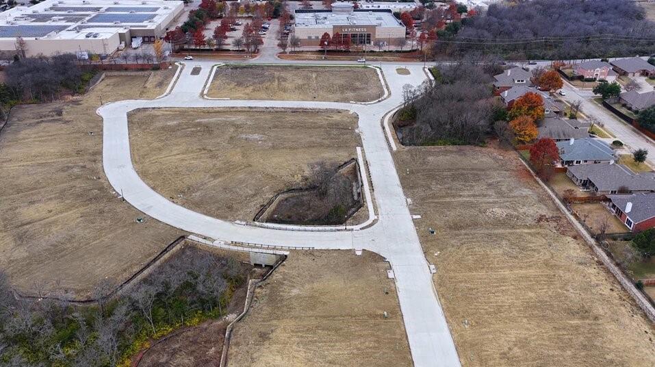 READY TO BUILD! APPROVED PLANS AND PERMITS. Grayhawk Ranch is a unique community of 35 SFRs offering a flowing blend of semi contemporary style architecture surrounded by plush green space spread across 17.5 acres of landscape. All the floor plans and permits are included. This nature friendly residential development site is the heart of Rowlett. Close to the George Bush Tollway and walkable to the retailers and restaurants Final Plat approval from the City of Rowlett and architectural plans are ready for this development to start building those beautiful houses. This property includes architectural plans for 4 models with various elevations and floor plans.  Some neighborhood brands include: Super Target, McAllisters, PetSmart, Jason's Deli, Raising Cane's and LA Fitness. Less than a mile from the Rowlett Dart Rail station that goes into downtown Dallas.