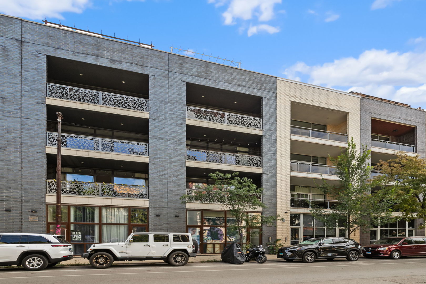 Welcome home to this absolutely stunning 3-bedroom, 2-bathroom condo in a 2018 construction building, located in the heart of the California Corridor in Humboldt Park.  This modern, second-floor walk-up checks all the boxes. Step inside through the oversized solid front door and you'll be immediately greeted by a sun-drenched, extra-wide open-concept layout featuring a dedicated dining area, spacious living room, soaring ceilings, and an expansive front terrace.  The chef-inspired kitchen boasts custom two-tone Italian cabinetry, high-end appliances, abundant sleek storage, and a large quartz island-perfect for entertaining. Additional highlights include hardwood floors throughout, fireplace, and floor-to-ceiling west-facing windows with custom window treatments. The luxurious primary suite offers a fully built-out walk-in closet, a private rear terrace, and a spa-inspired bathroom complete with a double vanity, soaking tub, and walk-in shower. Additional features include a gated/covered tandem parking spot and access to a shared rooftop deck with skyline views-all included in the price.This A+ location provides easy access to the Metra train, nearby bus stops, and some of the area's best restaurants and bars like The California Clipper, The Hi-Lo, and Rootstock Wine Bar. Plus, you're just minutes from some of the city's top parks, including Humboldt Park and Smith Park, offering an abundance of green space.
