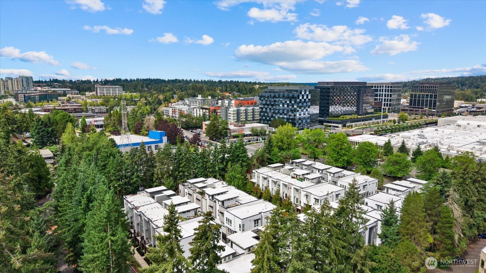 Luxury townhome located just a 10-minute walk from Meta and only 5 minutes by car to two light rail stations, I-405 and SR-520. Downtown Bellevue, groceries, hospitals, Montessori, Bright Horizons childcare and everyday essentials are all about 10 minutes away. Exceptionally connected, yet peacefully positioned within the community away from the bustle of main traffic.More than a 3-bedroom, 3-bath home, each bedroom is its own private suite. Together with a convenient powder room off the main living area, the layout offers exceptional privacy and ease for everyday living. Vaulted ceilings and floor-to-ceiling window create an airy sense of space, complemented by high-end finishes, premium appliances, a side-by-side 2-car garage, tankless water heater, efficient mini-split heating and cooling, and an EV charger outlet.Lovingly maintained by the owners for the past six years, this home offers a rare combination of thoughtful design, quality finishes and established neighborhood living. Unwind on the private rooftop terrace at sunset, surrounded by treetops with views toward Meta’s distinctive architecture. Located in the Bellevue School District, with a well-managed HOA and low dues, all in the heart of the vibrant Spring District. No rental cap.Special financing incentives available on this property from SIRVA Mortgage.