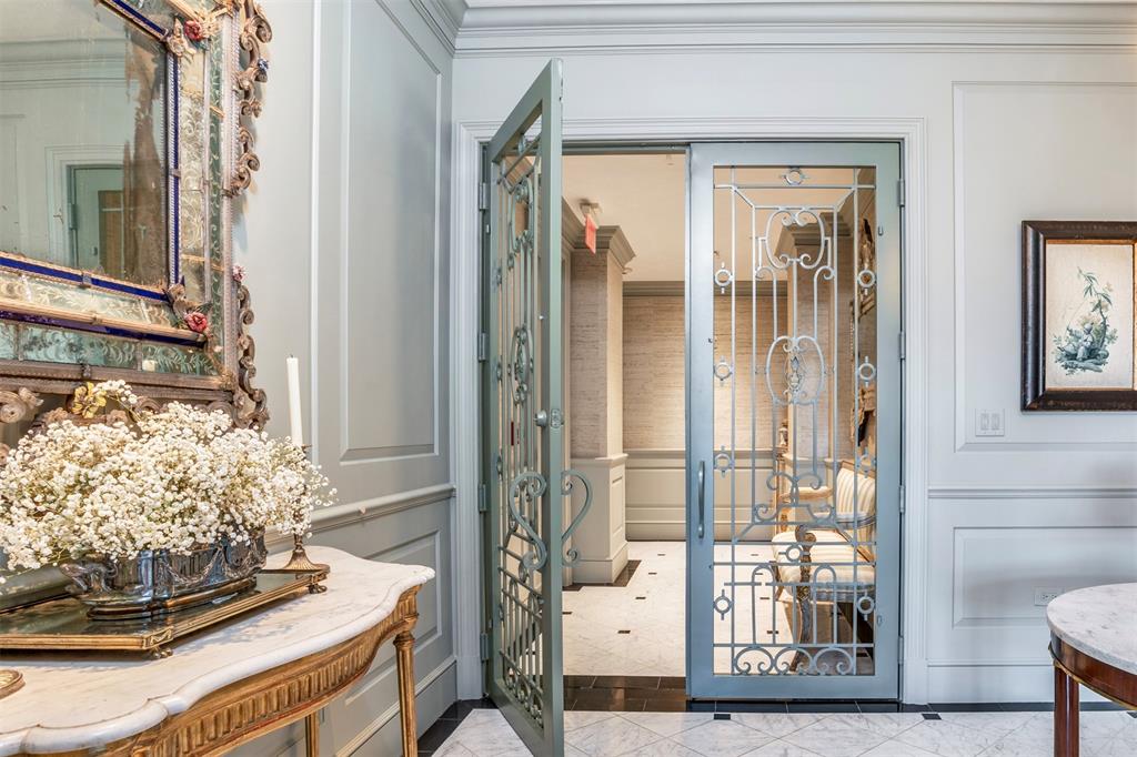Beautifully reimagined by Lyn Muse Interiors, this extraordinary residence offers the finest in Dallas high-rise living. Stunning custom millwork, rich herringbone hardwood floors, Jeffries wall coverings, and a dramatic marble entry with direct elevator access set the stage, complemented by floor-to-ceiling windows showcasing sweeping views of downtown Dallas and Turtle Creek Park. The formal living room features a striking natural stone fireplace. Two large private terraces offer wonderful additional space to entertain. The sun-filled breakfast room opens to a designer gourmet kitchen appointed with luxury appliances, a wine refrigerator, and access to its own private terrace. The spacious primary suite features dual marble baths features Waterworks and Dornbracht plumbing fixtures and custom walk-in closets. French doors lead to a lovely study with an ensuite bath that can easily function as a third bedroom. A separate guest suite offers a private bath and a spacious walk-in closet.Three reserved parking spaces (#196, #197, #304). Residents enjoy all amenities at The Vendome, including 24-hour valet and concierge service, a resort-style pool and cabanas, fitness center, owner’s library, L’Orangerie event room, three guest suites, dog park, and controlled building access.