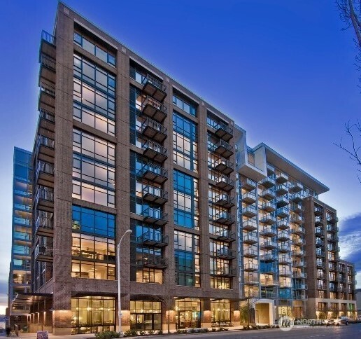 Large open 1 bedroom with eastern exposure and peak a boo Space Needle view. Home features 9 ft ceilings. Hardwood floors, custom cabinetry, Stainless appliance, deep soaking tub with rain showerhead. Beautiful tile surround and amazing closed space for all of your storage need. Bridling features 24/7 concierge, owner lounge with private supper club and Chef's kitchen. 2 guest suites with full kitchens. Business center, rooftop terrace w/BBQ, fitness center, dog run & dog wash area.