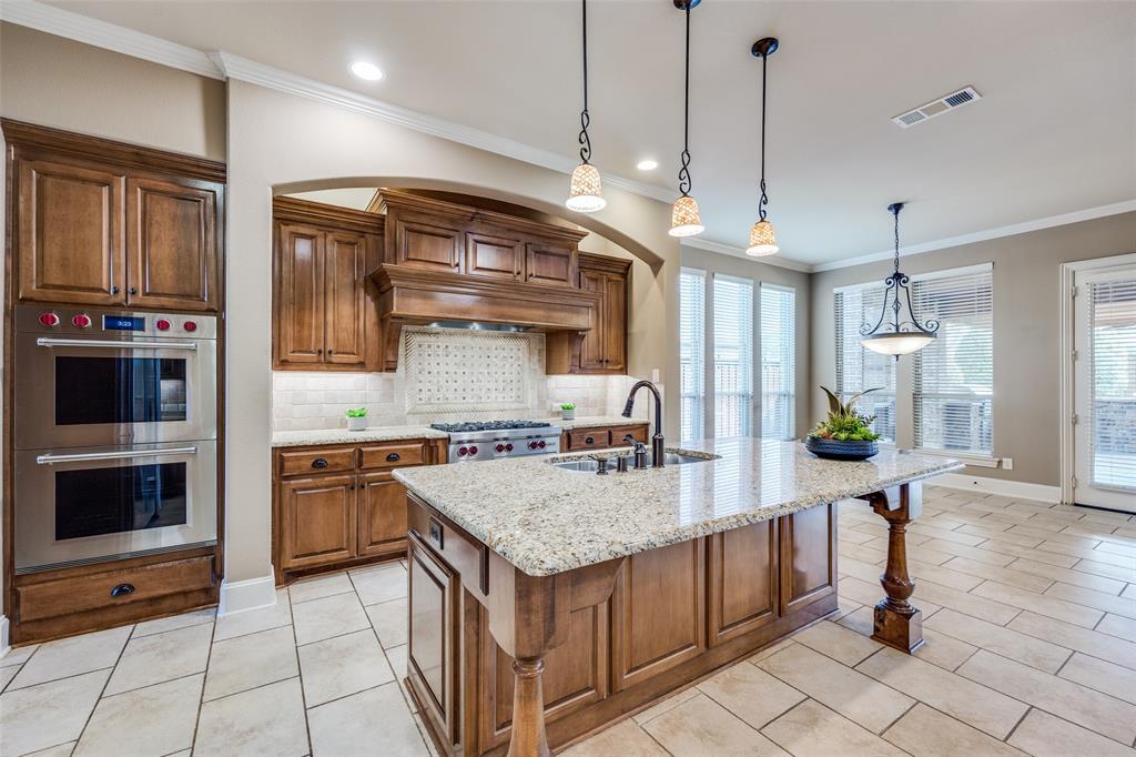 New Price + $10K Buyer Incentive! *OPEN HOUSE SATURDAY, SEPT. 20TH AND SUNDAY SEPT 21ST 1-3PM* Don’t miss this incredible opportunity to own a luxury Huntington-built home in the prestigious Castle Hills community! This 5-bedroom, 5.5-bathroom estate offers over-the-top comfort and functionality with every bedroom featuring a private en-suite bath and walk-in closet—ideal for multigenerational living or hosting in style. Step inside through a dramatic two-story foyer and into the private study, complete with coffered ceilings and custom built-ins. The heart of the home is a chef’s dream kitchen with Wolf appliances, Sub-Zero refrigerator, Miele dishwasher, granite countertops, an oversized island, and a butler’s pantry with wine fridge. The kitchen flows seamlessly into a bright family room and casual dining space, perfect for everyday living and entertaining. Tucked privately at the rear, the main-level primary suite is a true retreat with peaceful views, a cozy sitting area, and a spa-inspired bath featuring dual vanities, a garden tub, walk-in shower, and an expansive custom closet. Enjoy resort-style outdoor living with a covered patio, wood-burning fireplace, built-in outdoor kitchen, tranquil fountain, and a private grassy yard—ideal for pets, play, or even a future pool.Upstairs offers even more with a spacious game room with wet bar, a dedicated media room, and a split-bedroom layout for added privacy.Additional highlights include: 3-car garage + extended driveway:Abundant storage throughout: New carpet installed March 2025. All located in the heart of Castle Hills, with access to community pools, clubhouse, tennis courts, trails, parks, and the beloved Village Shops with dining and retail. *Buyer and Buyer's Agent to verify all listing information.*