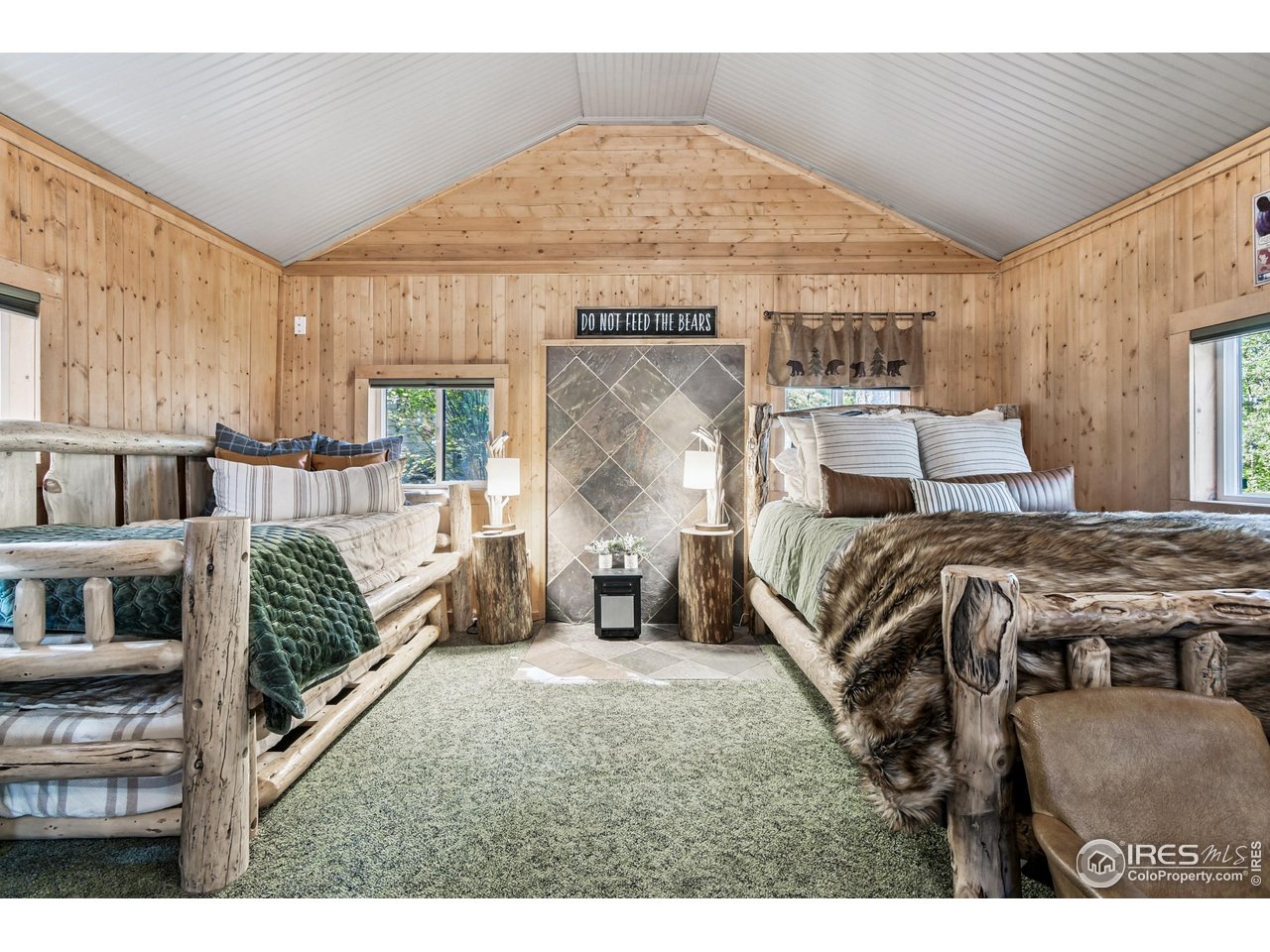 Two charming cabins located on Riverside Drive, a county maintained road. The main cabin hosts a comfortable living room with a freestanding gas fireplace, an eat-in kitchen, lower level bedroom and a 3/4 bath. Next to the main cabin is the Bunkhouse, a spacious cabin for guests, office or just for fun. These two cabins offer enough flexible space for everyone to gather and create wonderful memories. Outside you'll enjoy a relaxing deck for grilling and a patio ideal for entertaining or taking a hot tub. The main cabin has been certified by Wild Fire Partners and electric was upgraded to 200 amp service in main cabin. Also consider purchasing adjacent properties listed at 511 Riverside MLS# 1044138 with over 300' of creek frontage and 543 Riverside MLS# 1044128 with another cabin ready to be completed. This is a rare opportunity to purchase 3 contiguous properties with over 7 acres near the creek and multiple cabins. Seller will credit the Buyer $20,000 toward a new septic system. Buyer is advised to contact their mountain agent for more information on options for upgrading utilities. This is a treasured location for those seeking hiking, fishing, and biking along the friendly Riverside road. Seller requires 24 hour notice to see cabins. Seller owns 6 acres of river front property, 511 Riverside Dr MLS# 1044138 $200,000, within walking distance of the cabins. Seller will offer a discount with an offer that includes both 541 Riverside Dr & 511 Riverside Dr.