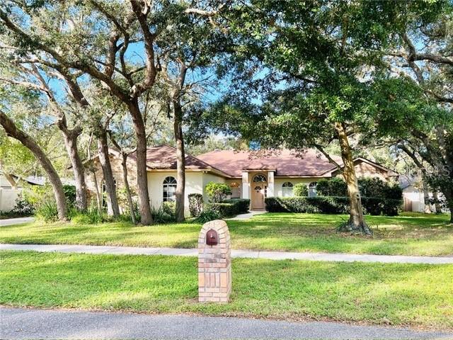 Welcome home to Cardinal Oaks Cove — one of Lake Mary's best-kept secrets with no HOA or CDD! Tucked along quiet, tree-lined streets in a golf cart-friendly neighborhood, this 4-bedroom, 2-bath POOL home checks every box and then some.High ceilings and skylights brighten the open interior with natural light throughout the day. The kitchen and family room are separated by a fireplace that serves as a stunning architectural half-wall. It's the kind of feature that makes cold Florida winter evenings feel genuinely cozy. A formal dining room and living room provide additional space for entertaining. The split floor plan delivers real privacy and flexibility. The spacious primary suite features a walk-in closet, en-suite bath with a soaking tub and separate shower, and a connecting door to an adjacent bedroom that can serve as a nursery, gym, or home office. On the other side of the home, two additional bedrooms share a second full bath.Out back, your own private retreat awaits. A spacious covered patio extends your living outdoors, flowing into the fully fenced backyard centered on a beautiful pool — perfect for morning swims, weekend entertaining, or simply unwinding at the end of the day. The oversized two-car garage goes beyond just parking — with room left over for a hobbyist, the weekend mechanic, or anyone who needs a workspace at home.A-rated schools, mature landscaping, and a location that puts restaurants, shopping, and entertainment just minutes away. Come put your personal touch on this home!