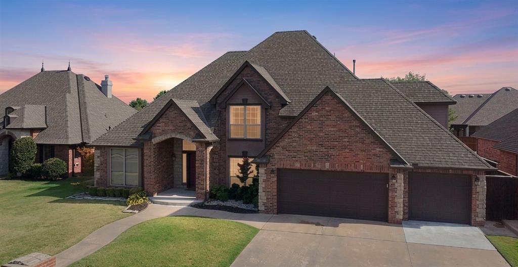 Beautiful two-story brick home in southwest Oklahoma City offering 5 bedrooms and 2.5 baths with a spacious, well-designed floor plan and quality finishes throughout. The inviting interior features a formal living room plus a dramatic two-story family room highlighted by two gas fireplaces, creating a warm and impressive gathering space. The formal dining room is ideal for entertaining, while the dedicated office provides a quiet space for work or study. The kitchen offers a center island, eating area, and Corian solid-surface countertops, providing both style and functionality. The half bath features granite countertops, while the full baths include cultured-marble double-bowl sinks. Laminate flooring extends through the living rooms, kitchen, dining room, half bath, and entryway. The office features solid wood flooring, ceramic tile is found in the full baths, and the bedrooms are comfortably carpeted. A beautiful curved staircase with wrought-iron balusters serves as a striking focal point overlooking the two-story great room. Step outside to a covered patio overlooking the large backyard, complete with a privacy fence for added seclusion and outdoor enjoyment. The property also includes a 3-car garage and a separate storage building, providing plenty of space for vehicles, hobbies, tools, and additional storage. Conveniently located in southwest Oklahoma City, this home combines spacious living areas, timeless brick construction, thoughtful details, and desirable outdoor amenities.