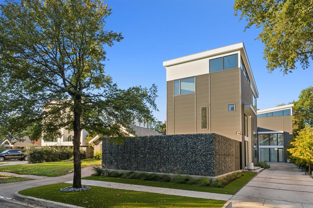 Award-Winning Modern Masterpiece by Paul Jankowski. Featured on the 2026 AIA Home TourDesigned and built by the award-winning team at Modern Living Dwellings, this exceptional residence showcases innovative architecture, thoughtful design, and high-quality finishes throughout. An urban oasis of style and sophistication, the home features expansive windows, glass doors, and skylights that fill the interiors with natural light, while a carefully curated lighting design creates a warm and inviting ambiance after sunset.The second level is designed for seamless indoor-outdoor living and entertaining. The chef’s kitchen opens effortlessly to the dining and living areas and an electronically screened outdoor living room complete with a built-in grill and fireplace. The kitchen features high-end appliances, an oversized island, a walk-in pantry, and custom cabinetry offering abundant storage.The third floor is dedicated to the luxurious primary suite, complete with a separate private living area. The first level offers an ensuite guest bedroom and a versatile secondary living space with a built-in kitchen, opening to a beautifully landscaped backyard with a stunning saltwater pool.Extensive upgrades include electronic shades, Phantom screens, smart toilets, a whole-house water filtration system, security cameras, and much more.Ideally situated in a vibrant and evolving neighborhood surrounded by exciting new developments, this architectural gem offers exceptional walkability to the acclaimed restaurants, boutiques, and shops of Knox-Henderson and Greenville Avenue.The home is also available for purchase fully furnished, offering a seamless, turnkey living experience.