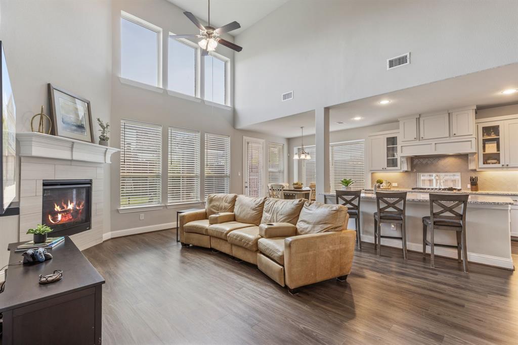 Experience the perfect blend of comfort, style, and convenience in this stunning 2,809 sq. ft. home, ideally located in the sought-after Lake Forest community. Built in 2019 by Grand Homes, this two-story beauty offers a thoughtful layout with 3 living areas, 2 dining spaces, a dedicated office, and 3 spacious bedrooms with 2.5 baths. The primary suite and home office are conveniently situated on the first floor, while upstairs you'll find a large game room, media room, 2 additional bedrooms, and a full bath. The home’s design impresses from the moment you enter, with two-story ceilings in the entry, dining room, and family room—each open to the game room above, creating a light and airy feel. Enjoy the south-facing backyard with plenty of sunshine, perfect for adding a pool, and relax under the covered patio in your large fenced yard. The north-facing front provides shade where you want it most. Lake Forest offers a family-friendly, master-planned lifestyle with a clubhouse featuring a kitchen and gym, a sparkling swimming pool, trails, and a sports field. Conveniently located near Highway 121, I-75, and the Dallas North Tollway, commuting and shopping are a breeze.