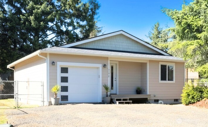 This craftsman home has a contemporary style and spacious feel. Meticulously maintained, this home looks brand new. The open concept layout has a seamless flow to the 2 bedrooms, and features Vaulted Ceilings in the living room and kitchen. Temperature stays cozy or cool with a Ductless Mini-Split and additional wall heaters in the bedroom as an optional heat source. Continuing through every room you will find Luxury Vinyl Plank flooring providing durability style and convenience. The kitchen is complimented with crisp white cabinetry, Quartz countertops and Stainless Steel appliances, while the wood-topped Island table offers a place to prepare meals and gather. The attached garage is extra deep, allowing you for ample storage space. Outside, the spacious backyard features an expansive concrete stamped Patio that provides generous space for entertaining or relaxing. Plus, the backyard is enclosed with a 6' chain link Fence, beneficial for pets, gardening and watching the deer pass by the back of the property. Come home to the peace and quiet of being nestled on a Cul-de-sac, yet still catch the Ocean breeze and the faint sound of the waves. Nearby you' will find Bill Ellis Memorial Park with access to Duck Lake. This home would make the perfect vacation get-away as well as a primary coastal residence.