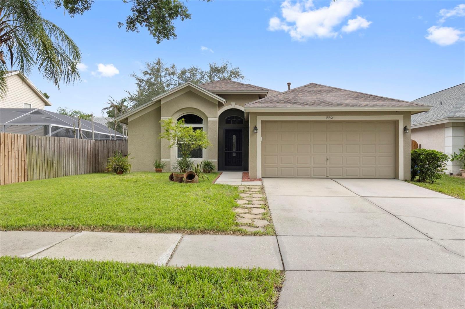 Welcome to this beautifully maintained 3-bedroom, 2-bathroom home offering 1,553 square feet of thoughtfully designed living space in the desirable Providence Lakes community of Brandon. Built in 1996, this move-in ready home features a functional split-bedroom floor plan, a two-car garage, low HOA fees and an interior laundry nook for added convenience. The home is also connected to natural gas, which supplies the range and heating furnace.The interior showcases a tasteful blend of bamboo hardwood, luxury vinyl plank and ceramic tile flooring, creating a warm, durable and low-maintenance living environment. The spacious primary bedroom features a walk-in closet and a private en-suite bathroom complete with a garden tub and spacious stand-up shower. Numerous major updates provide added value and peace of mind, including a new roof (April 2026), whole-house water line replacement (October 2023), A/C duct replacement (March 2021) and energy-efficient windows, French doors and sliding glass door installed in July 2018.The spacious living areas flow seamlessly to the screened rear porch, offering the perfect space to enjoy Florida's year-round outdoor lifestyle. Beyond the porch, you'll find a fully fenced, beautifully manicured backyard complete with a well-appointed pavered fire pit—ideal for entertaining, relaxing or gathering with family and friends.Conveniently located near shopping, dining, parks, highly rated schools and major commuter routes including I-75 and the Selmon Expressway, Providence Lakes offers easy access to downtown Tampa, MacDill Air Force Base and the surrounding Tampa Bay area. With its extensive updates, inviting outdoor living space, natural gas connection and prime Brandon location, this home is a must-see. Schedule your private showing today!