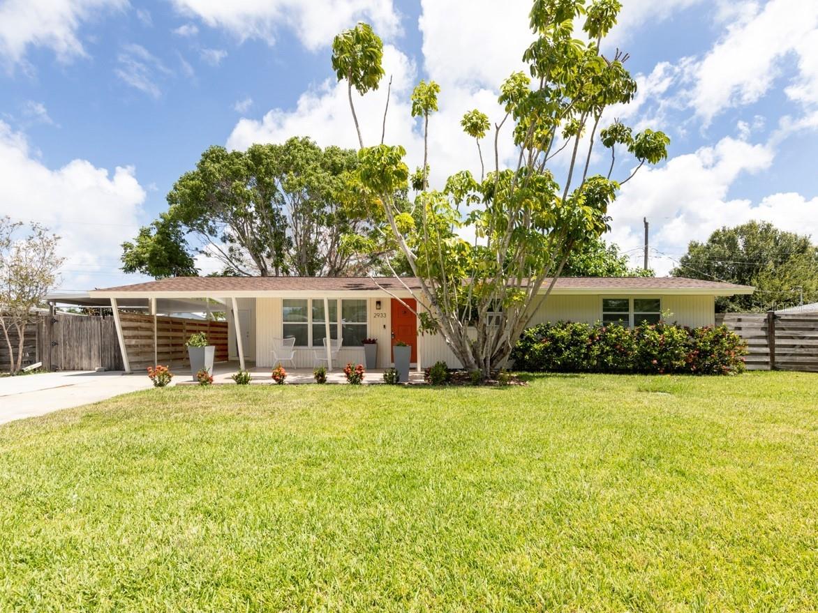 Nestled in one of Sarasota's most sought-after neighborhoods, this recently remodeled midcentury modern home is offered unfurnished or turn-key giving you the option to move right in or to use as your next investment property with a proven rental history of over 30 5-star reviews. Extensive updates throughout the home include a BRAND NEW RHEEM HVAC (2025), a NEWER ROOF (2022), new drain lines/plumbing (2022/2025) and major updates to the kitchen, bathrooms, and bedrooms (2022). Featuring three bedrooms and two full bathrooms, the home showcases vaulted ceilings and transom windows, infusing the space with natural light. The thoughtfully designed layout includes an open-concept living and dining area adjacent to the kitchen, perfect for entertaining. A custom built-in bookcase in the living room doubles as a hidden doorway to one of the bedrooms - ideal for use as a guest room, home office or extended living area. French doors off of the kitchen lead to a spacious and private fenced in backyard with room to create your own private oasis. Additional features include an oversized carport and shed complete with electricity - perfect for storage, hobbies, or a workshop. Located on a quiet street within city limits, you'll enjoy quick access to downtown Sarasota, Paver Park, Southside Village, Sarasota Memorial Hospital, and the famous Siesta Key Beach. The nearby Legacy Trail is just a bike ride away, offering a perfect blend of urban convenience and outdoor adventure. Whether you're looking for your dream home or a high-performing investment property, this is a rare opportunity to own a piece of paradise.