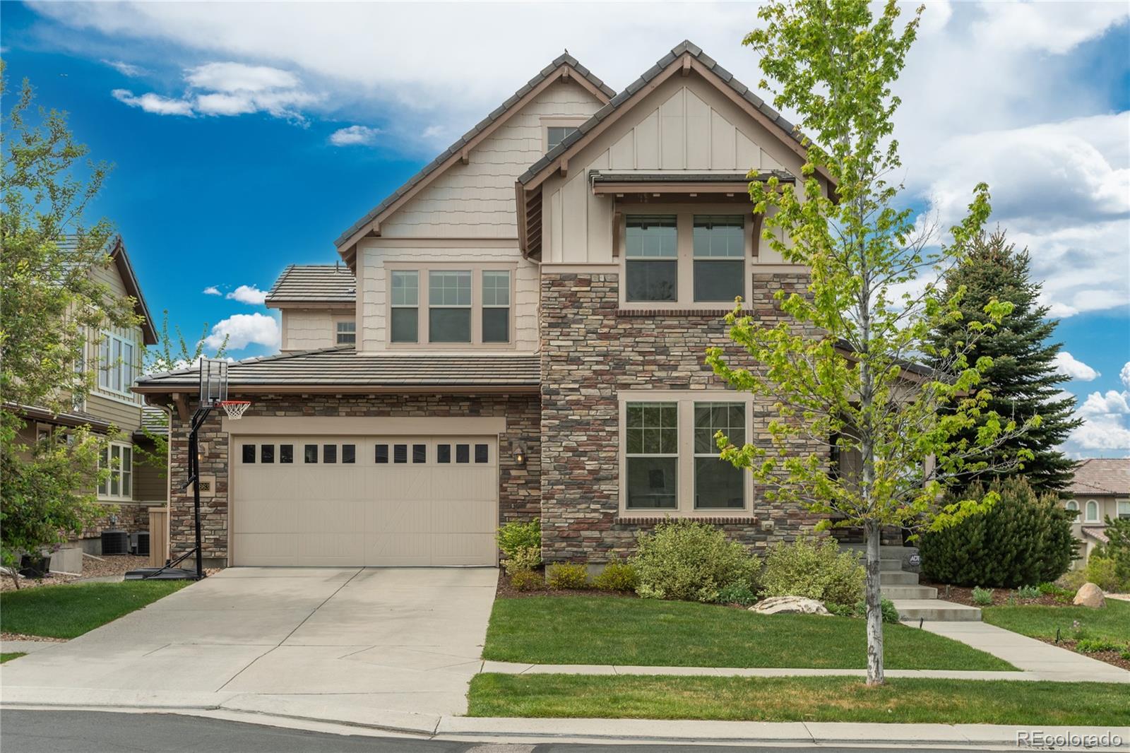 Views, views, views! Ideally situated on a premium lot with stunning mountain views in a highly sought-after gated community, this home showcases breathtaking scenery from multiple rooms. Upon entry, you’ll immediately notice the beautiful flooring throughout the main level. The main floor features a dining room with a cozy fireplace, a spacious great room with mountain views that opens to the kitchen, complete with a large island and walk-in pantry. You’ll also find a well-appointed laundry room with ample storage and a private office. Upstairs, the expansive primary suite offers a luxurious ensuite bath with dual sinks and a walk-in closet. The upper level also includes a versatile loft and three additional bedrooms—one with its own ensuite bath, while the other two share a full bathroom. The lower level is perfect for entertaining or relaxing, featuring a generous family room with a dry bar, an additional bedroom, and a bathroom. Step outside to the covered patio and take in the beautiful mountain views. Embrace the Backcountry lifestyle with resort-style pools, a fitness facility, trails, parks, ponds, and so much more.