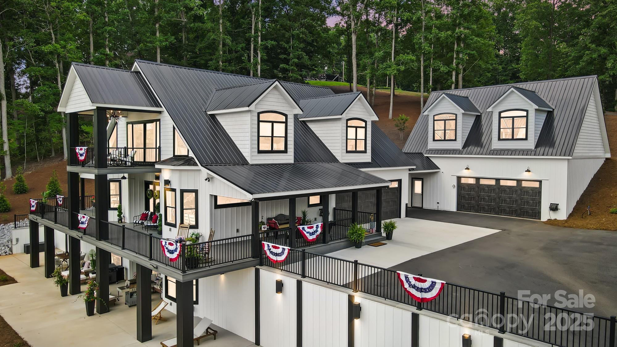 Welcome to your dream home on Lake Tillery! This home offers sweeping views of the Uwharrie National Forest, perfect for peaceful mornings and unforgettable sunsets. Every detail has been designed with luxury and convenience in mind. This home offers a gourmet kitchen with custom cabinetry, quartz countertops, under counter lighting, smart Frigidaire professional freestanding column refrigerator, touchless sink faucets, air controls for overhead island lighting and disposal. Custom cabinetry and quartz counter tops throughout kitchen, laundry room, bathrooms and fireplace. Spa like primary bath with freestanding soaking tub, walk in glass shower featuring double shower heads, body spray system, and mounted jets. Laundry room with built in bench and coat rack. Tankless hot water heater. Finished basement with custom antique glass bar cabinetry. Wrap around porch with composite trex decking and a cozy bed swing. This home is the perfect blend of serene lakefront living.