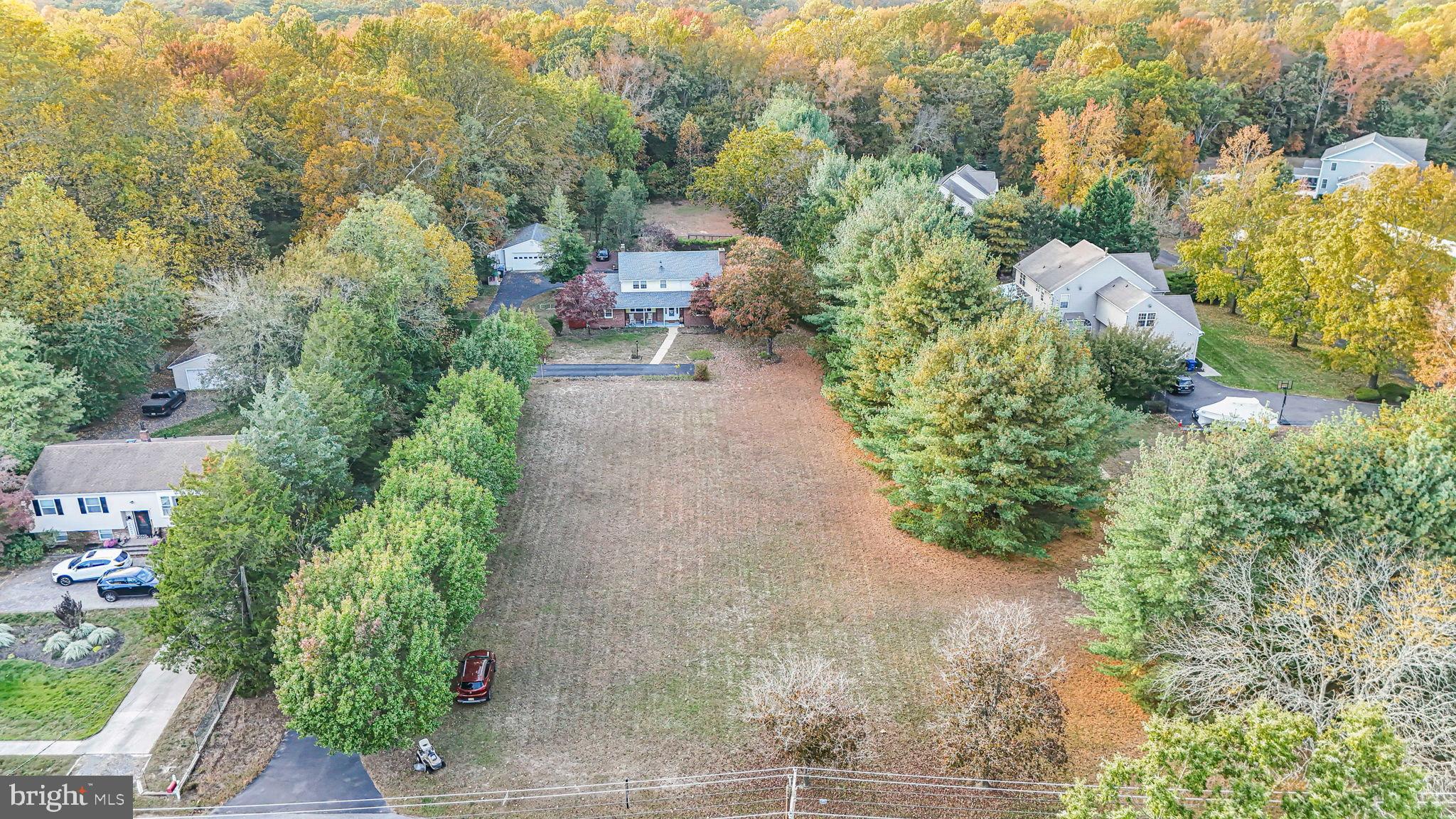 Exceptional 5-Acre Farm House in Historic Medford Village***PRICE REDUCED*** Discover the rare opportunity to own an impeccably renovated home on a sprawling 5-acre property nestled in sought-after historic Medford Village, minutes from boutique shops, dining, parks, and highly rated schools. The unique 5-acre parcel offers privacy, beauty, and expansion potential for your family, or your business. A portion of the lot is wooded with a private nature path that leads to a picturesque creek. Even more rare are the public water and sewer services to the property!Your new home offers updates throughout with all of the big-ticket items taken care of for you! The roof and HVAC were replaced in 2021 with a second central air system added to the 2nd floor and a mini-split system added to the rear Sunroom in 2024 to ensure cool summer days and warm winter nights throughout the home, and the driveway was newly seal-coated within the last few weeks.The 1st floor offers an expansive ensuite with custom window treatments, a private living room, renovated full bath, and new in-suite laundry space. Perfect for multi-generational living, or those who simply want flexibility in their living space. A HUGE newly renovated kitchen offers modern finishes, luxury vinyl flooring, tons of storage, under cabinet lighting, drawer lighting, a touchless trash & recycling cabinet, and 2 dishwashers! Perfect for entertaining! A newly added mudroom with storage bench, new custom half bath, and luxury vinyl flooring add to the seamless functionality of this space. Custom built-in cabinets, an eat-in area, newly carpeted and painted rear sunroom, a newly painted living room with charming and functional fireplace complete the 1st floor.As you move to the 2nd floor, you will find 3 generously sized bedrooms in addition to a 2nd ensuite bedroom with a fully renovated private full bath and walk-in closet. The full hall bath was refreshed within the last 30 days. Within the last few years, all of the second floor spaces received new carpeting, wall finishes and updated fixtures. The 2nd floor also has a newly installed stacker laundry area and a new central air system.Your finishing touches can complete the fully finished basement. The owners have added newer luxury vinyl flooring to the main living area and carpeting to the additional rooms. These spaces are ideal for a home theater, gym, or family retreat. A nostalgic bar area, additional fireplace, walk-up stairs, and a utility room complete this versatile space.A large, detached garage with shelving and high overhead space is perfect for your vehicles, storage, workspace, hobbies, and an unending list of other possibilities. A porch to enjoy colorful sunrises, a large rear deck to watch the deer pass by in the morning, and a firepit space to watch the colors change on the trees in the fall add to the ambiance of this expansive property. An additional tool shed will help keep things organized!This home is a seamless blend of timeless charm and modern sophistication. Whether you're hosting weekend gatherings on the expansive lawn or simply enjoying tranquil mornings in the sun-drenched kitchen, you'll feel the unique magic that makes Medford Village so beloved.The owners are contingent upon finding suitable housing prior to closing. The listing agent has a financial interest in the sale of this property.