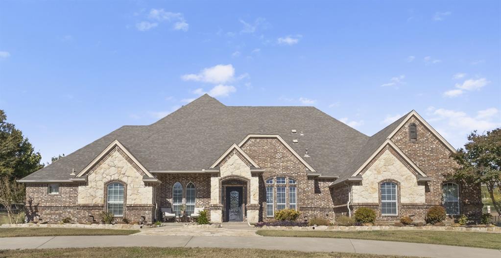 A home you will never want to step away from! Located in the gated Harbour View Estates near Eagle Mountain Lake, this stunning custom home sits on over an acre and comes with a fully equipped guest space, perfect for guests, family, or a private office. Inside, you’ll love the bright open layout with two living areas, a private study, a beautiful stone double-sided fireplace, and a chef-inspired kitchen. The primary suite offers a true spa-like escape with a jetted tub, walk-in shower, and oversized organized closet.A spacious bonus room just off the main living area features a half bath and it has direct access to the pool.  Two bedrooms on the main floor share a Hollywood style bath.Upstairs, the game room can flex as a 4th bedroom, media room, or kids’ retreat Step outside to your own backyard oasis featuring a custom pool with water feature, spacious covered patio, fire pit, and a stone cabana prepped for an outdoor kitchen. Enjoy community pools, trails, a playground, and quick access to highways and shopping.
